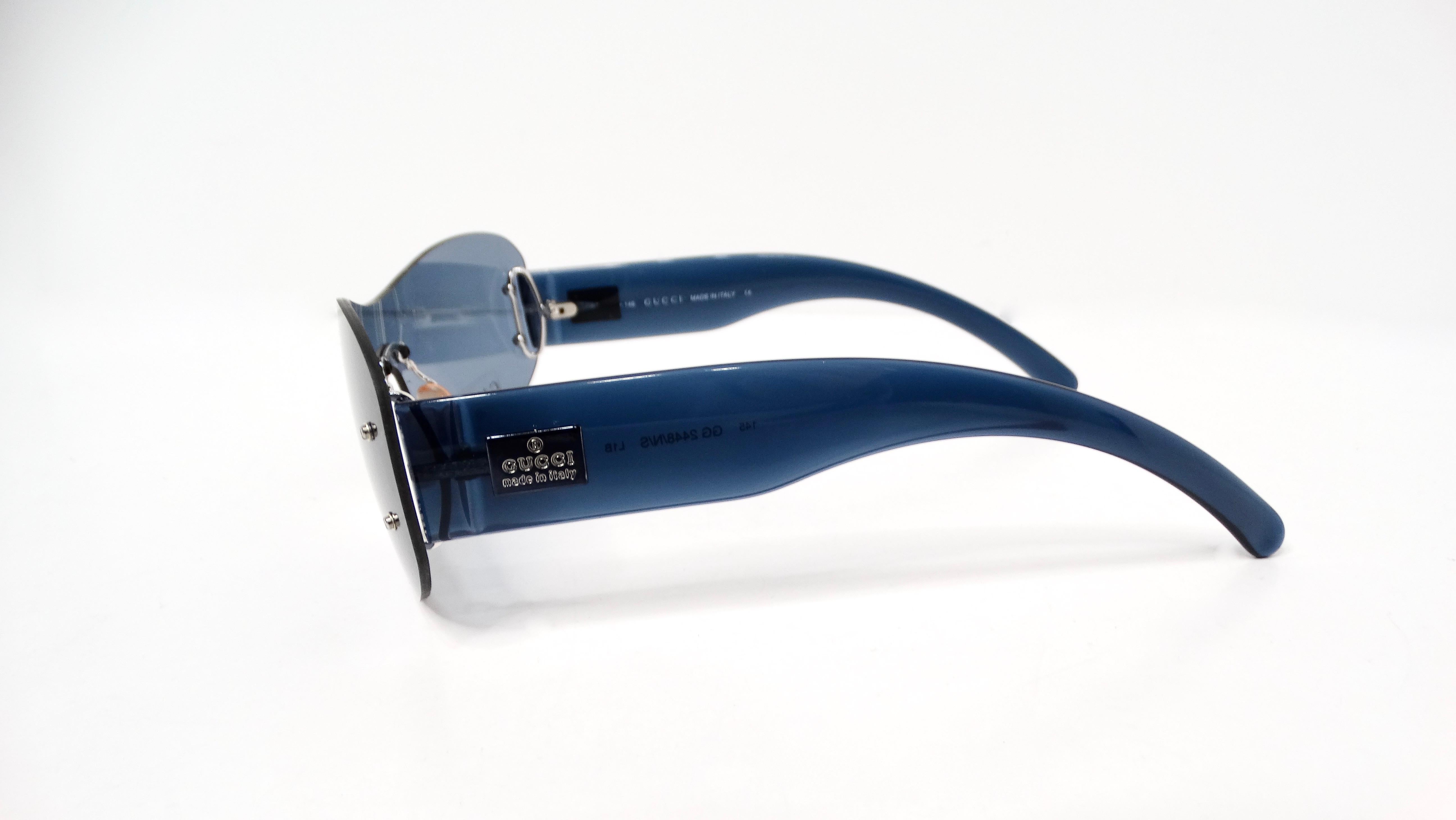 The 1990s Gucci Blue Tinted Shield Sunglasses epitomize the era’s bold fashion statements, characterized by their striking design and iconic branding. Crafted in Italy, these avant-garde sunglasses feature an oversized shield silhouette that offers