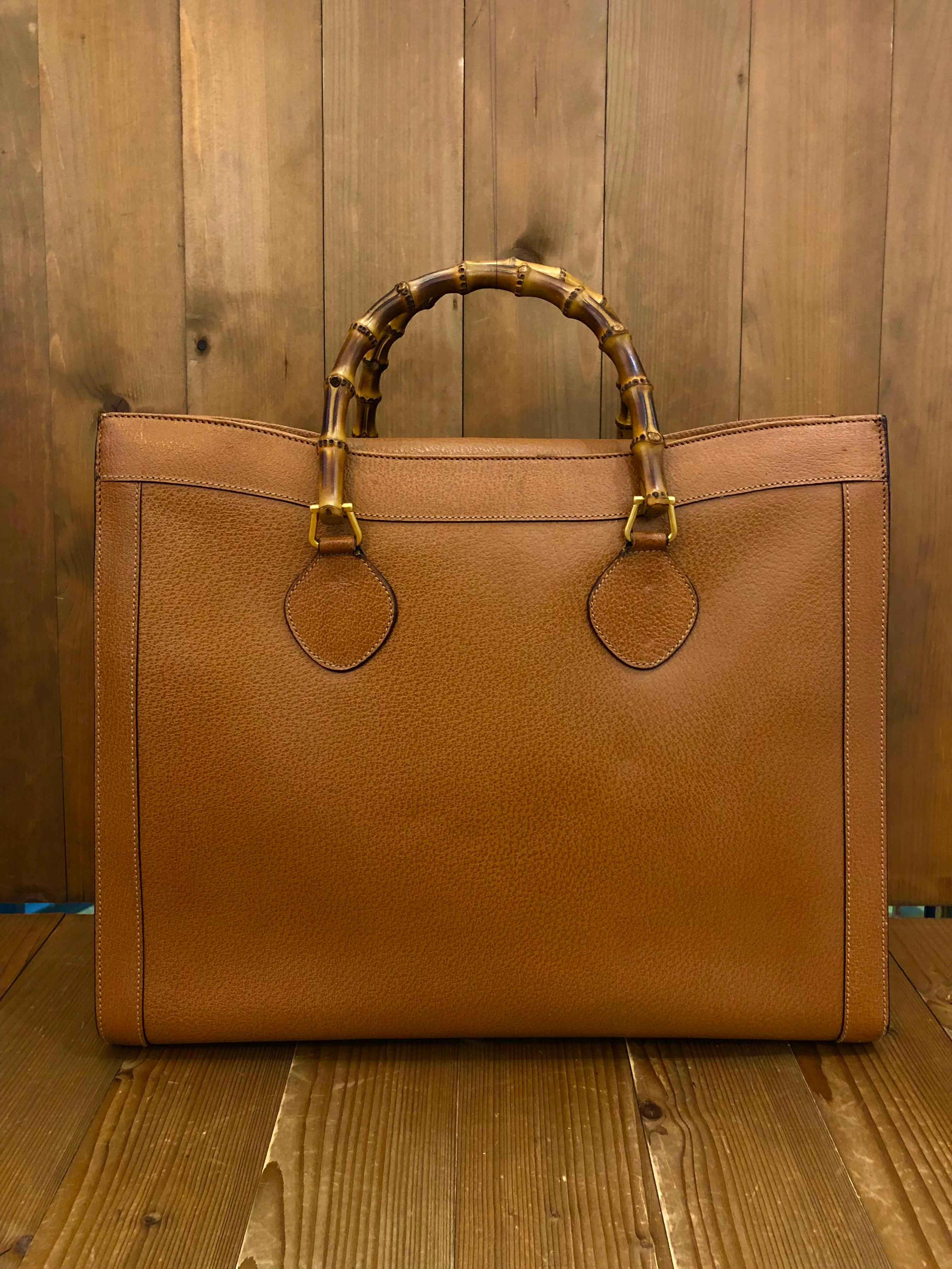 This vintage GUCCI Diana bamboo tote in large size is crafted of pigskin’s leather in brown. Top magnetic snap closure opens to a new interior in beige. It features two main compartments/one zip compartment and one interior zippered pocket. Made in