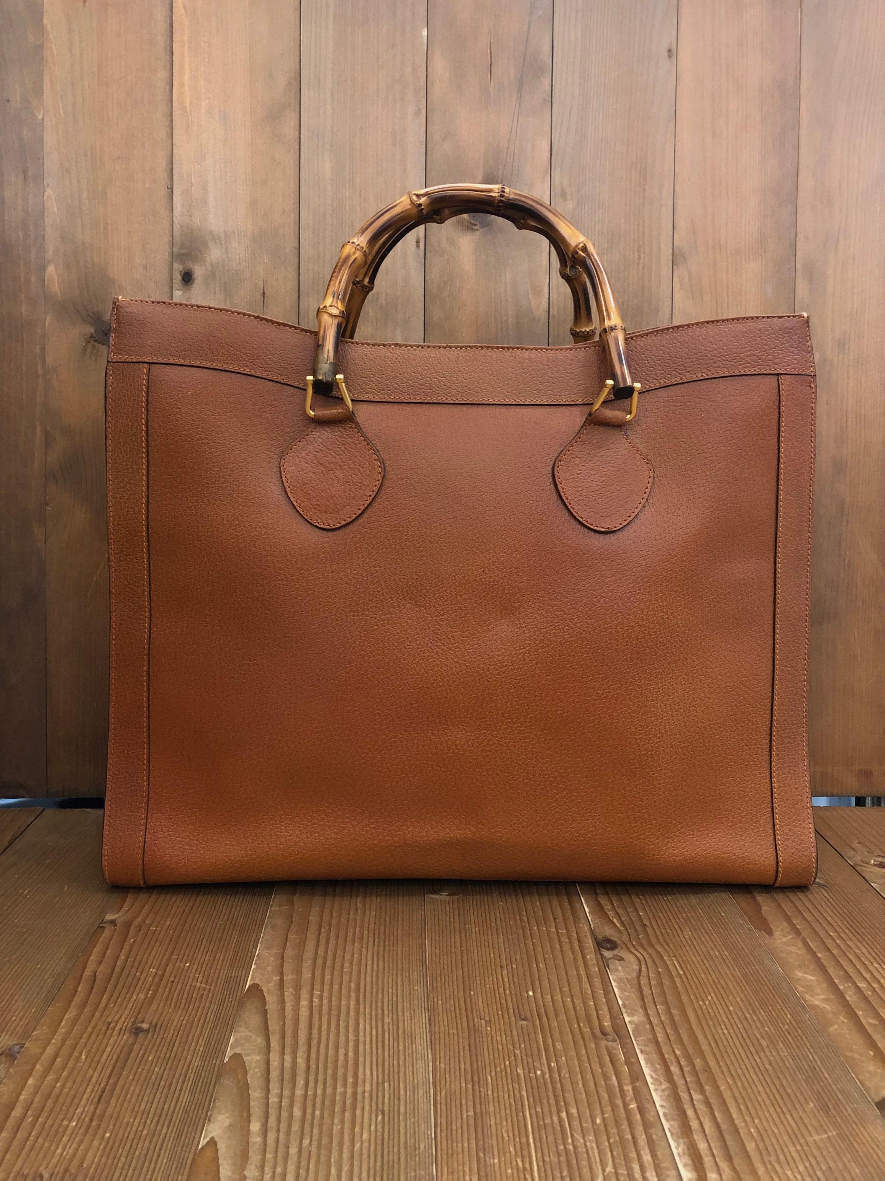 1990s Gucci bamboo tote in brown leather. The Bamboo tote is one of Princess Diana's favorite purses. Gucci revamped this Bamboo tote in 2021 winter collection. Made in Italy. Measures 16.75 x 14 x 5.5 inches handle drop 4.5 inches featuring two