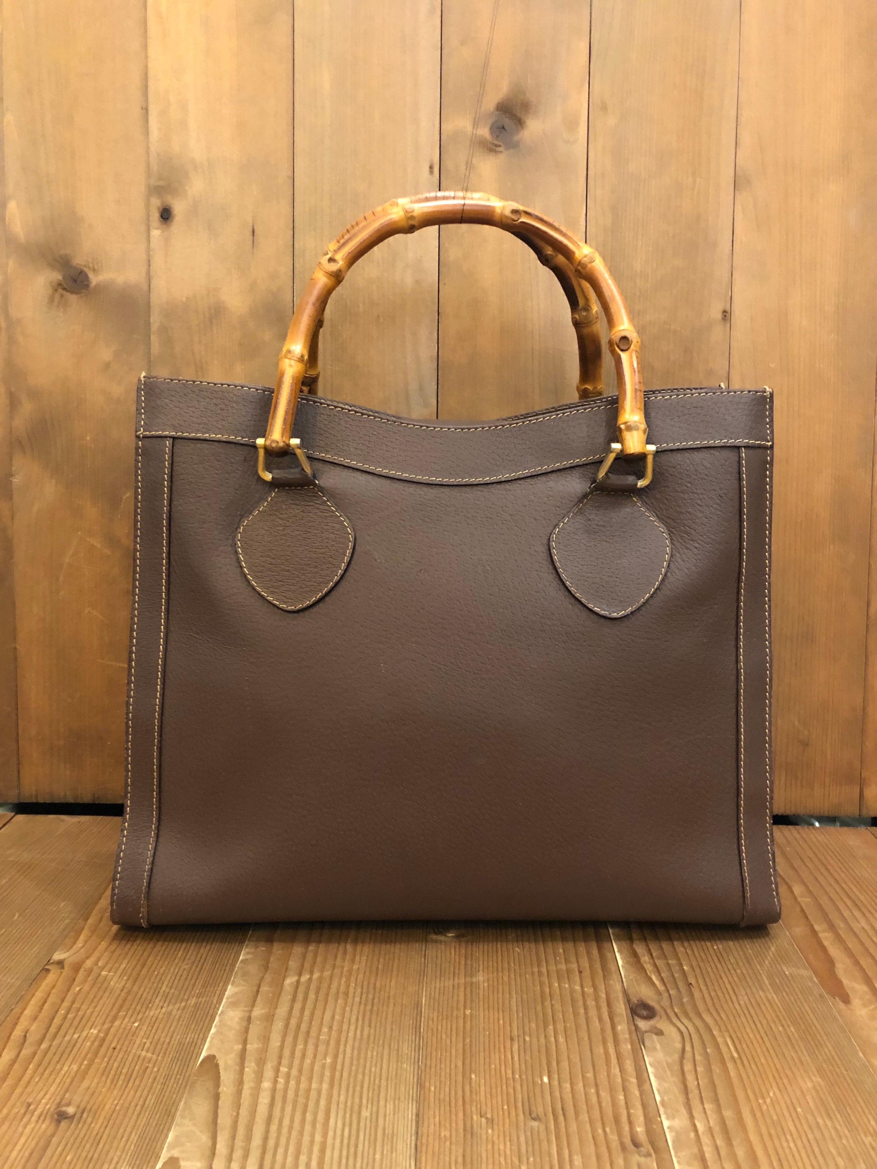 1990s GUCCI bamboo tote in chocolate brown leather. The Bamboo tote is one of Princess Diana's favorite purses. Gucci revamped this Bamboo tote in 2021 winter collection. Made in Italy. Measures 13 x 11 x 5.5 inches handle drop 5 inches. It features