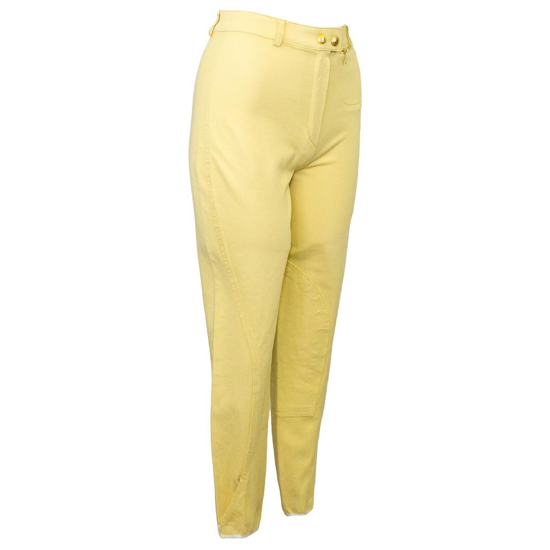 Cropped butter yellow jodhpurs from the iconic mid 90's-early 2000's Tom Ford Gucci era. These jodhpurs sit high on the waist with a zipper and double gold tone Gucci logo button fly. They feature a small single zippered pocket at the left hip when