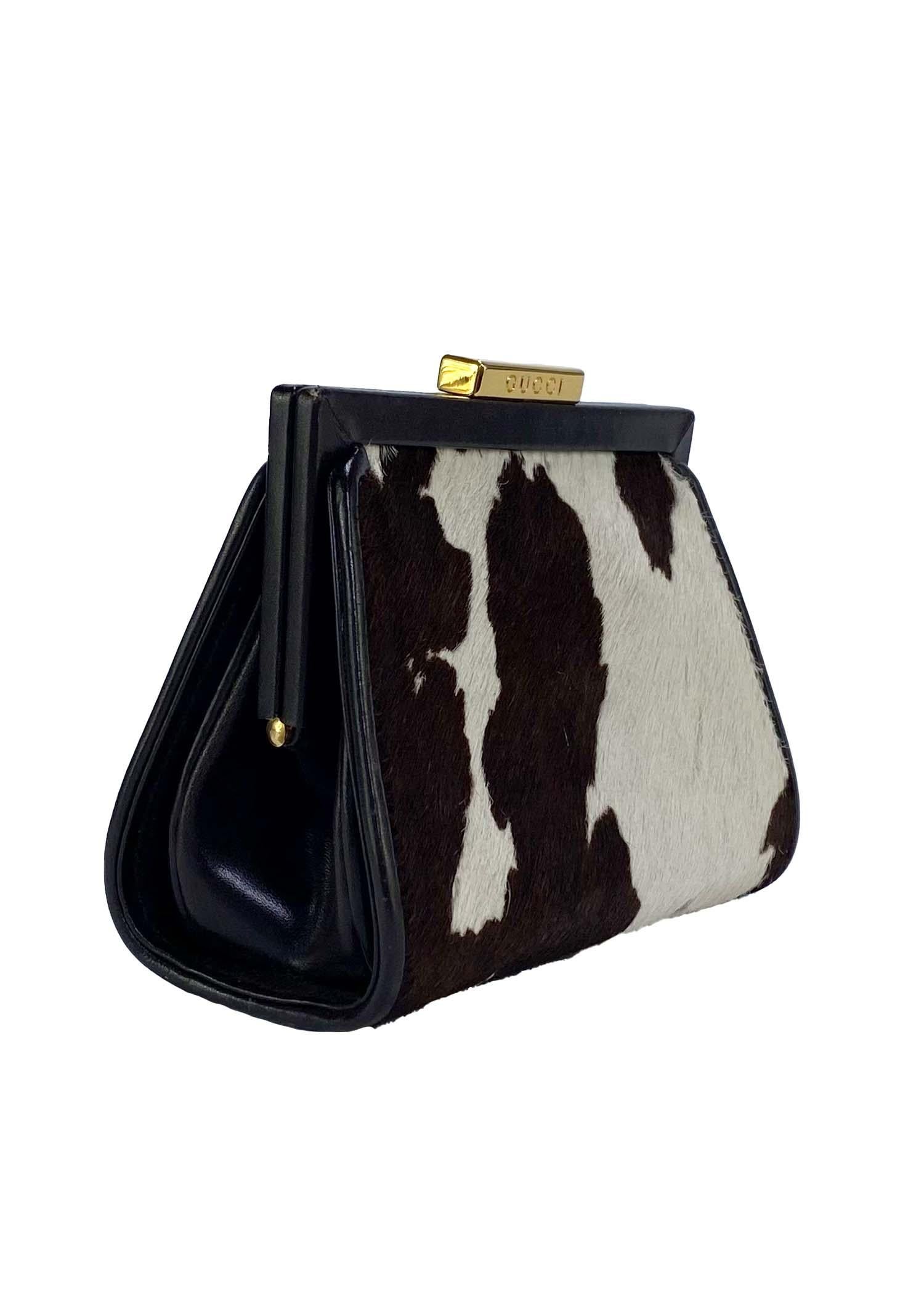 TheRealList presents: a beautiful and unusual pony hair cow print Gucci fanny pack, designed by Tom Ford. Likely from the 1995 collection, this versatile bag can be used as a clutch or waist bag when the matching belt is added. The bag is