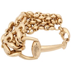 1990s Gucci Horseshoe Bit and Gucci Link Design Flexible Gold Bracelet