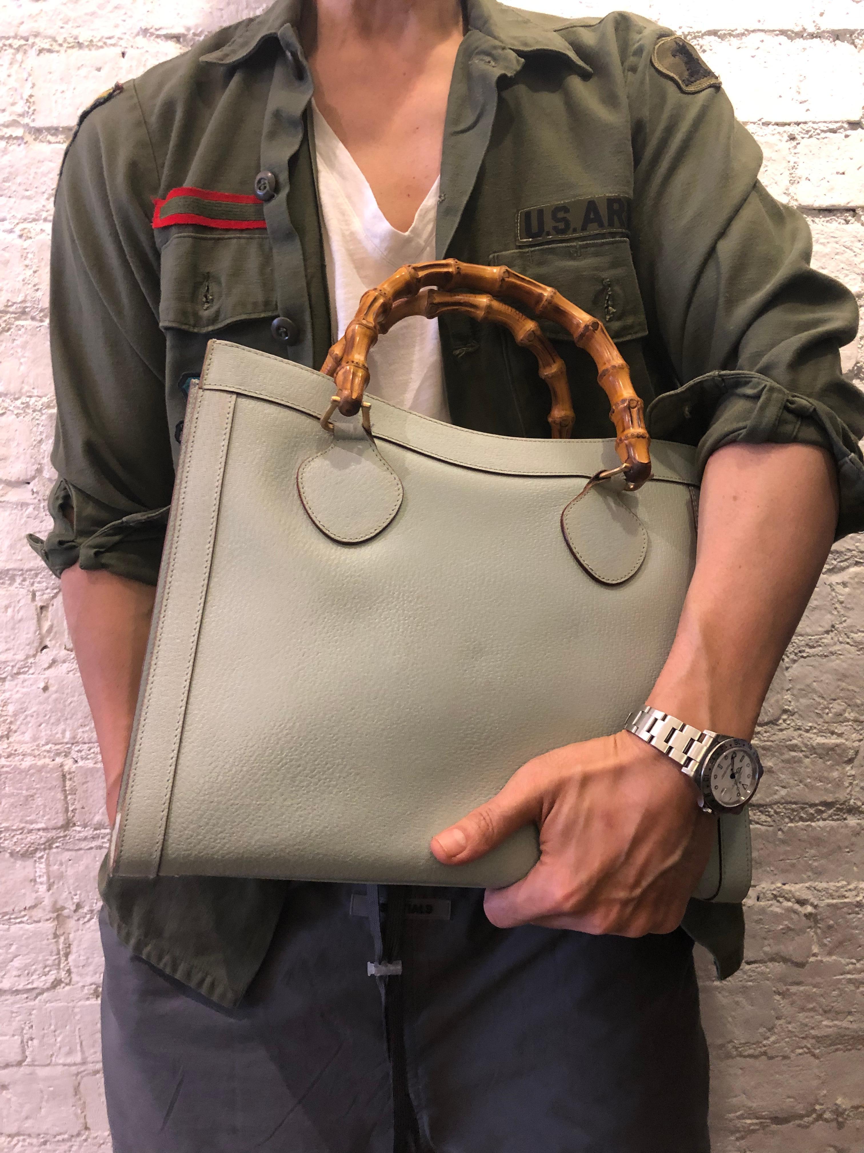 This vintage GUCCI Diana bamboo tote is crafted of pigskin’s leather in light green and matt gold toned hardware. The Bamboo tote is one of Princess Diana's favorite purses. Gucci revamped this Bamboo tote in 2021 winter collection. Made in Italy.