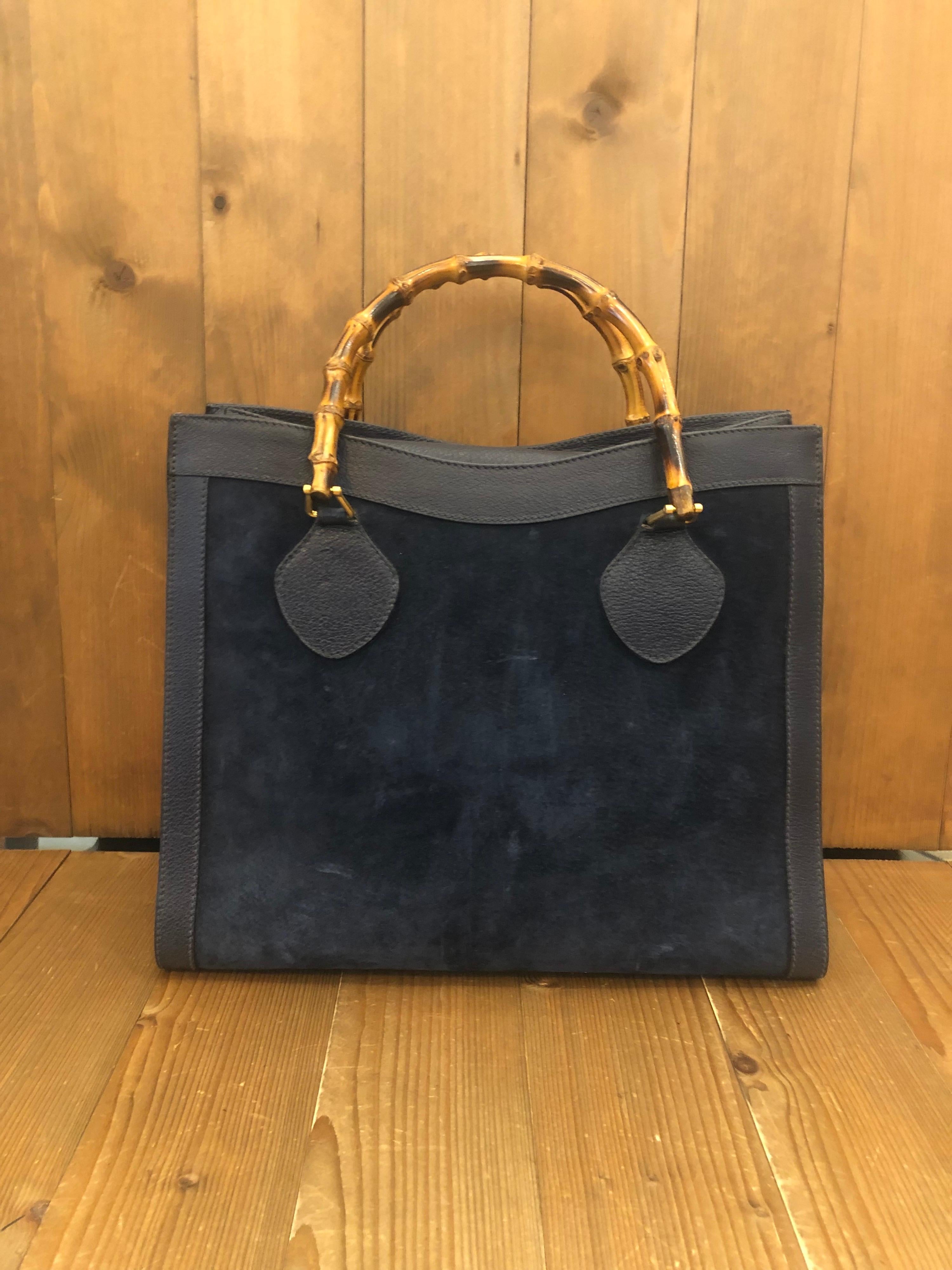 1990s Gucci bamboo tote in navy suede and leather. The Bamboo tote is one of Princess Diana's favorite purses. Interior fully refurbished and no more flakiness. Gucci revamped this bamboo tote in 2021 winter collection. 

Material: