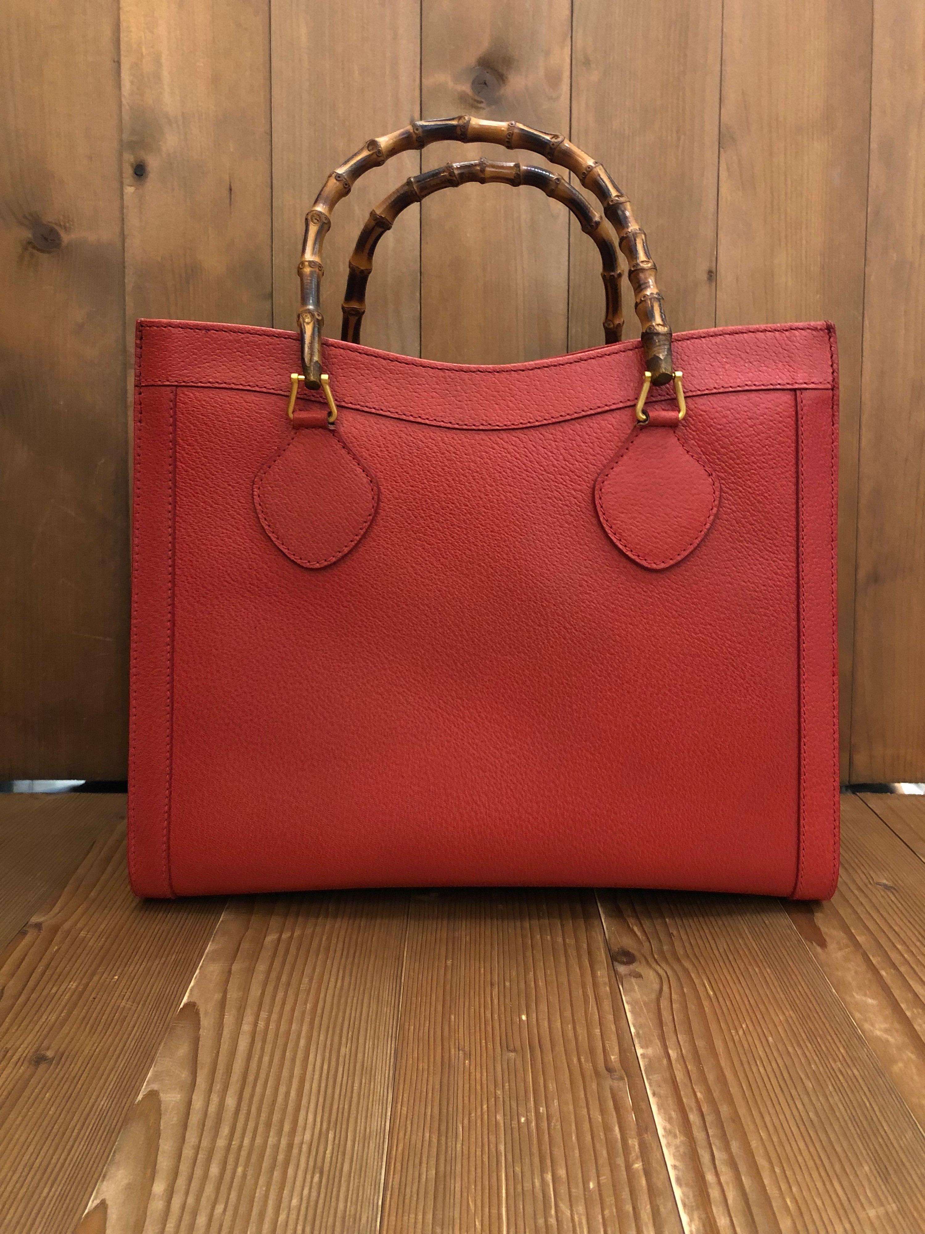 1990s Gucci bamboo tote in red leather. The Bamboo tote is one of Princess Diana's favorite purses. Gucci revamped this Bamboo tote in 2021 winter collection. Made in Italy. Measures 13 x 11 x 5.5 inches handle drop 5 inches. It features two main