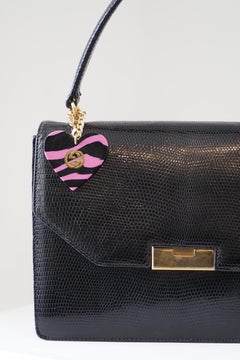 1990s Gucci vintage lizard handle bag with pink black gold heart charm