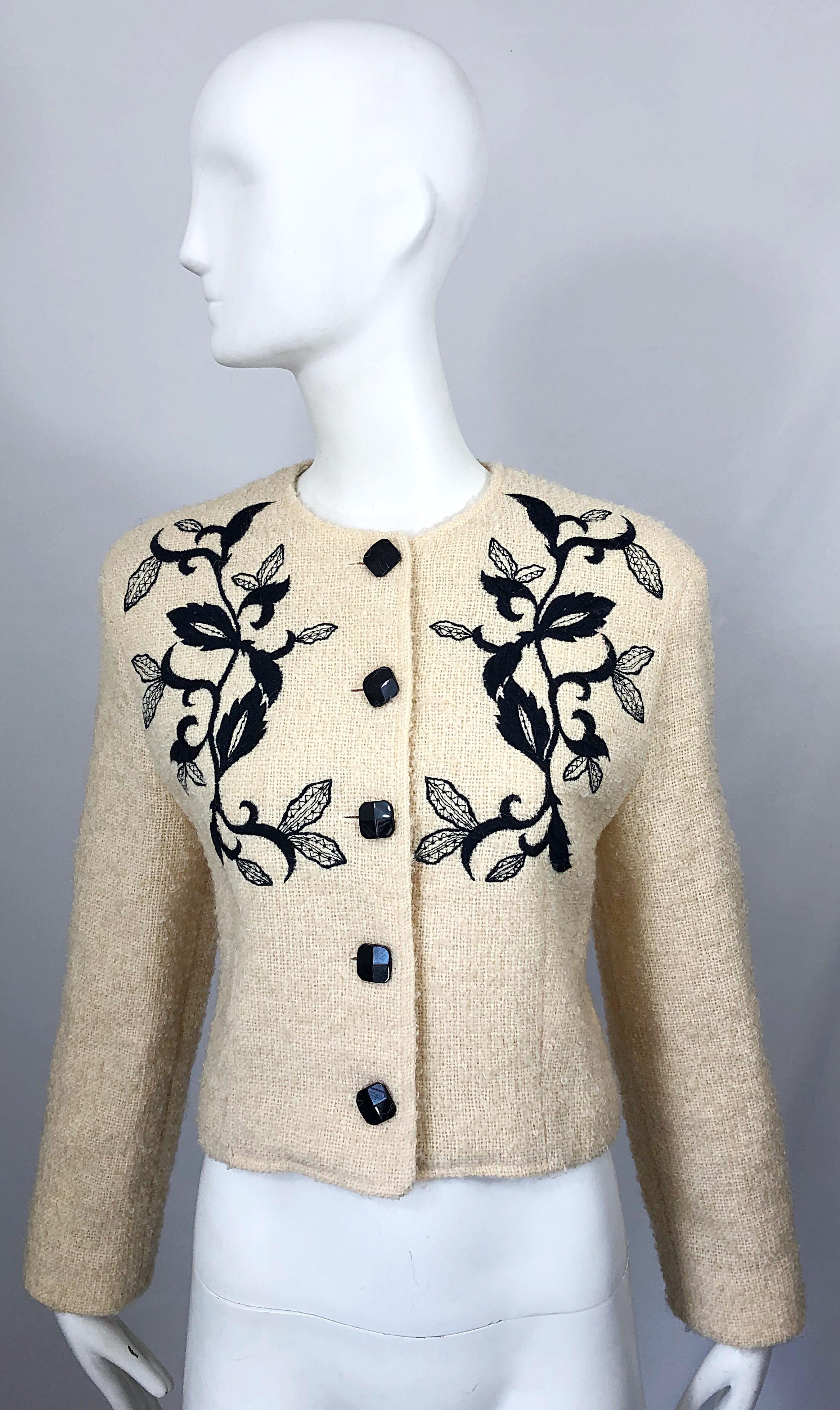 Stylish vintage 90s GUY LAROCHE ivory and black embroidered cropped jacket / blazer ! Features a soft ivory wool with intricate black embroidery on the front. Black lacquer buttons up the front. Fully lined in silk. Can easily be dressed up or down,