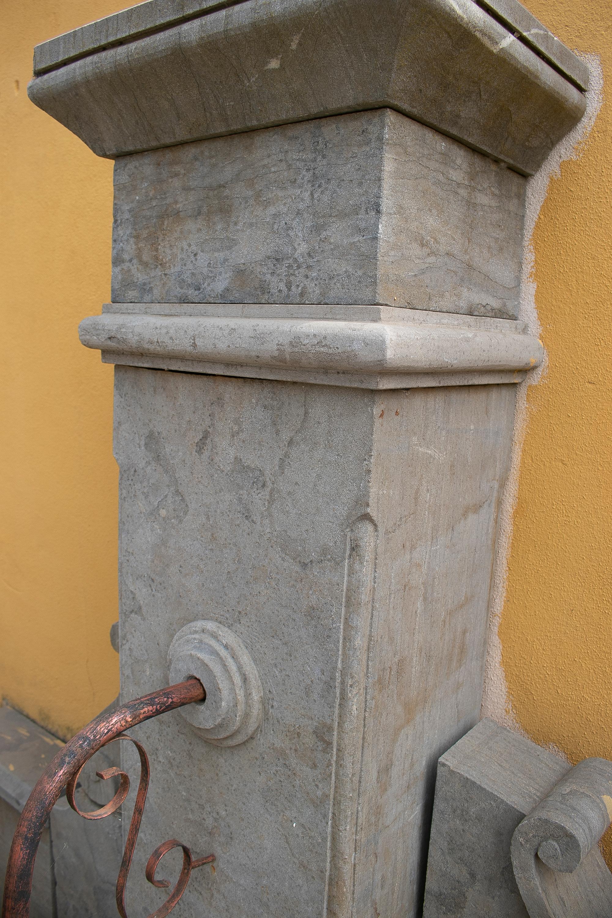 1990s hand carved aged stone antique reproduction wall fountain.