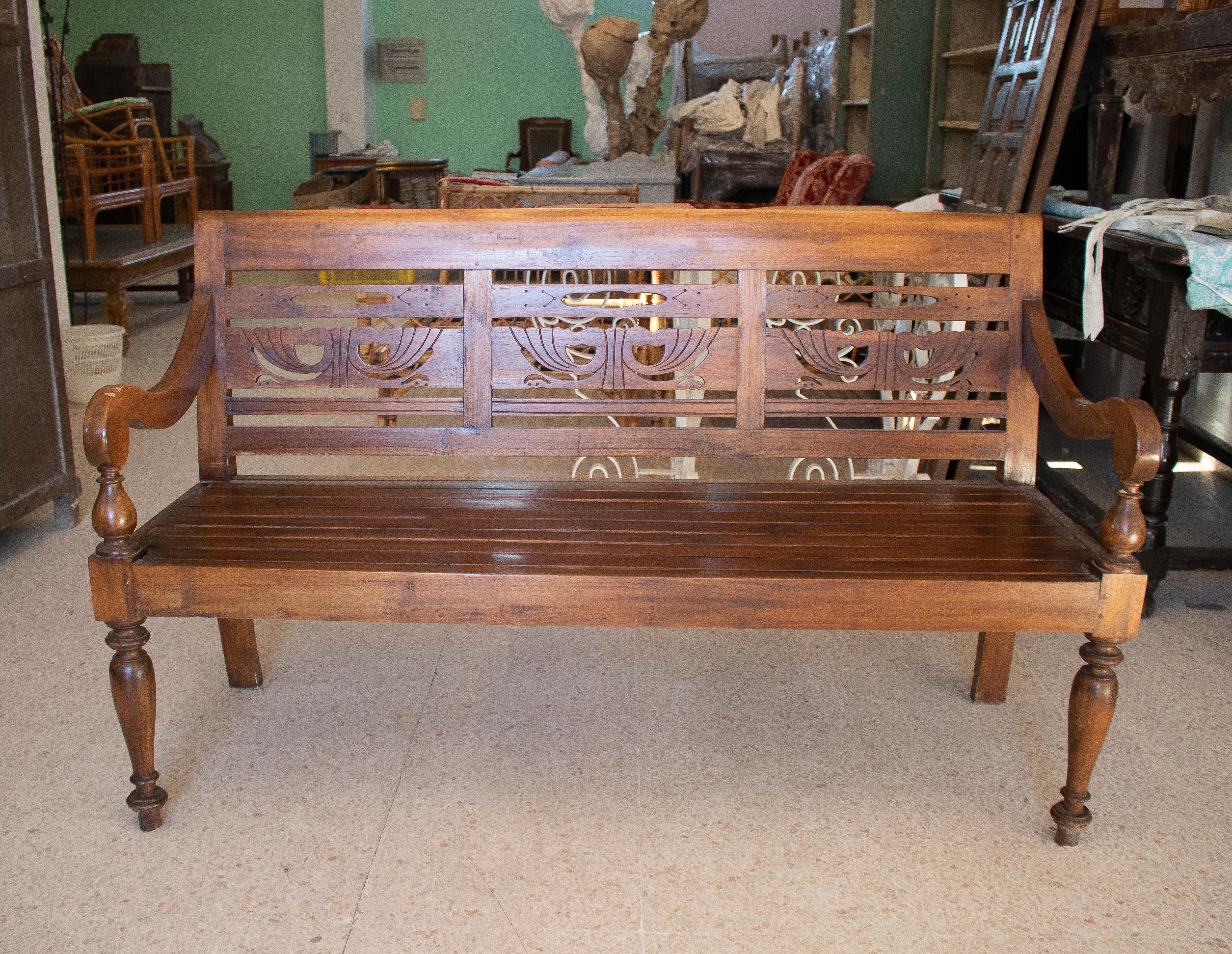 Rustic 1990s hand carved Indonesian colonial wooden garden bench.