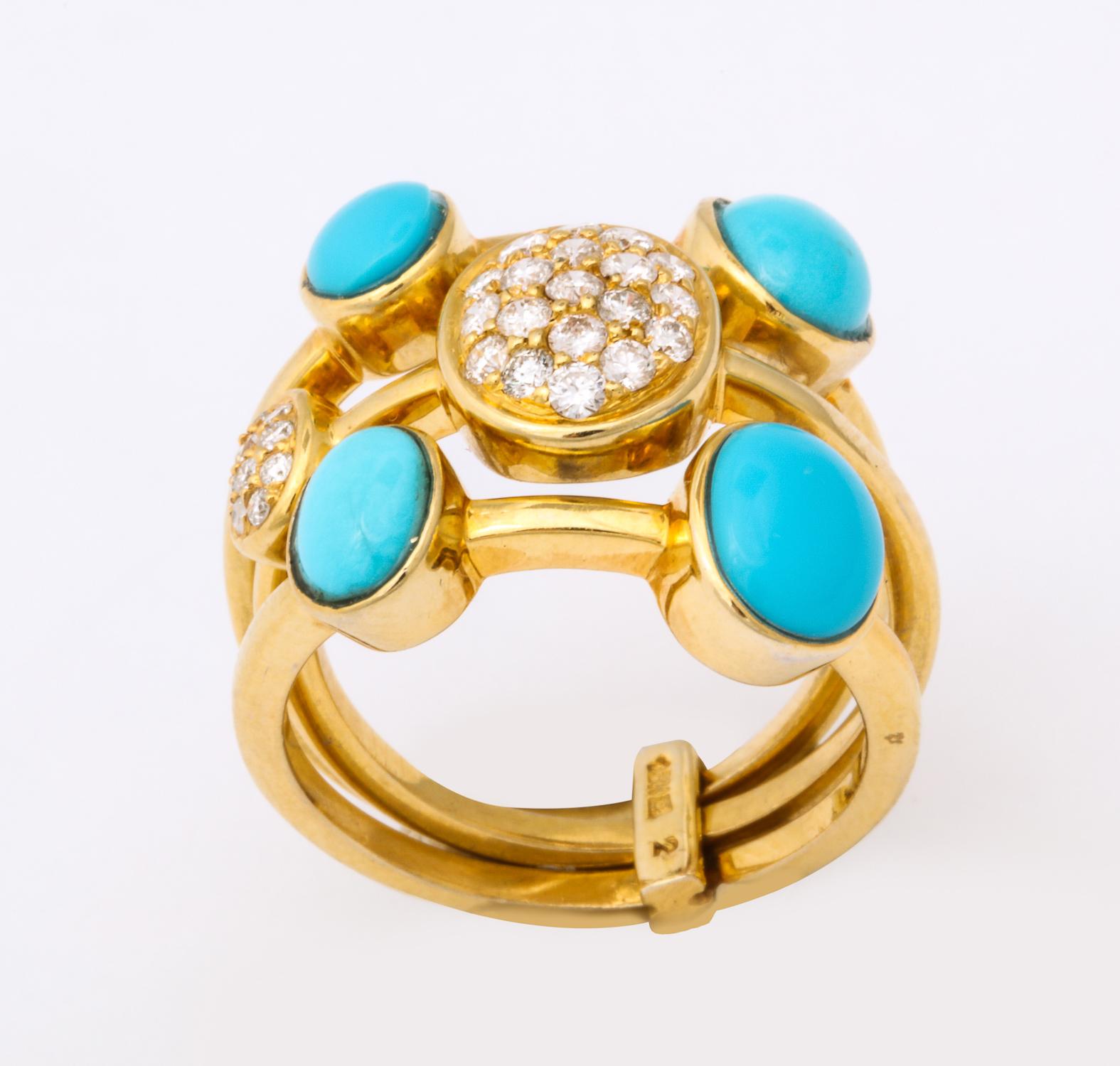 One Ladies 18kt Yellow Gold Triple Band Harem Style Flexible Ring Composed Of Three Flexible And Moveable Bands Designed With Four Bezel Set Turquoise Stones And Further Embellished With Two Pve Diamond Bezel Set Panels. Diamond Weight Approximately