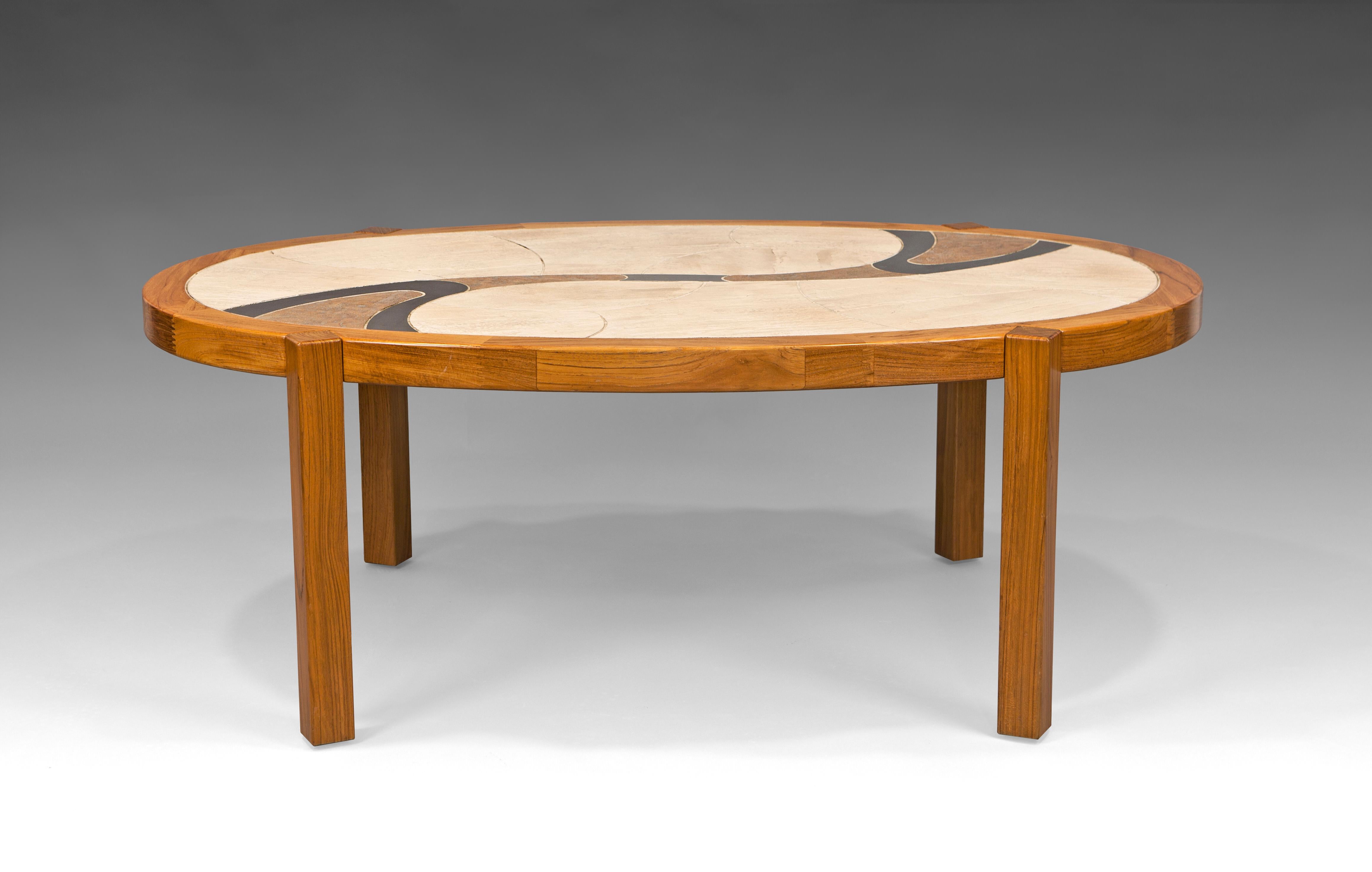 ‘’Arizona’’ coffee table by Haslev, Denmark, 1990s

Oak wood coffe, cocktail or center table featuring an oval shape with earth-tones ceramic tiles in an organic pattern. Two mettalic inlay details give the surface a more complex and attractive