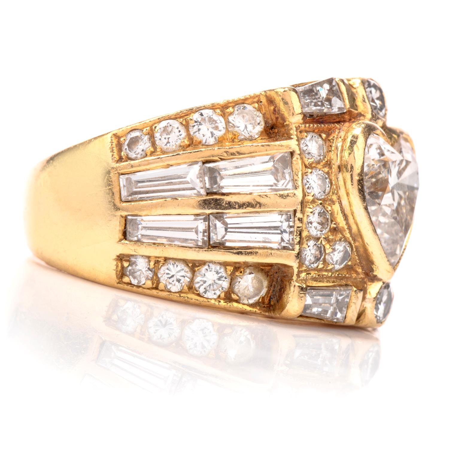 Great present for someone very special. 

This 1980's Diamond ring in crafted in solid 18K yellow gold.  Centered with one natural heart diamond, approx. 1.25 carats, VS1-VS2 clarity. Set in bezel. 

This stunning ring furthermore embellished with