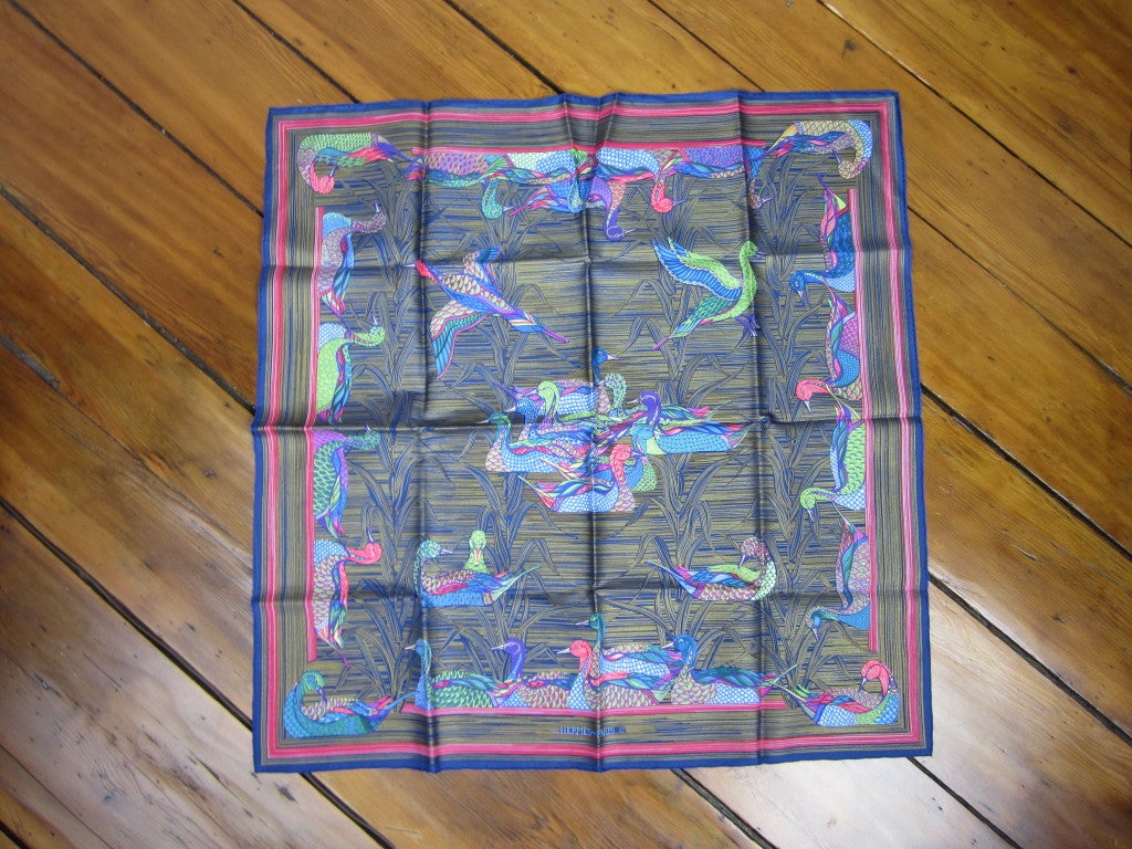 Stunning Hermes Silk scarf, New old stock, never worn. Stunning striped Blue, Pink and Golds, Bird Motif, Made in France, Hand Rolled. Scarf has a heavier hand to the fabric.  Box included (has a bit of wear on the corners) Please be sure to check
