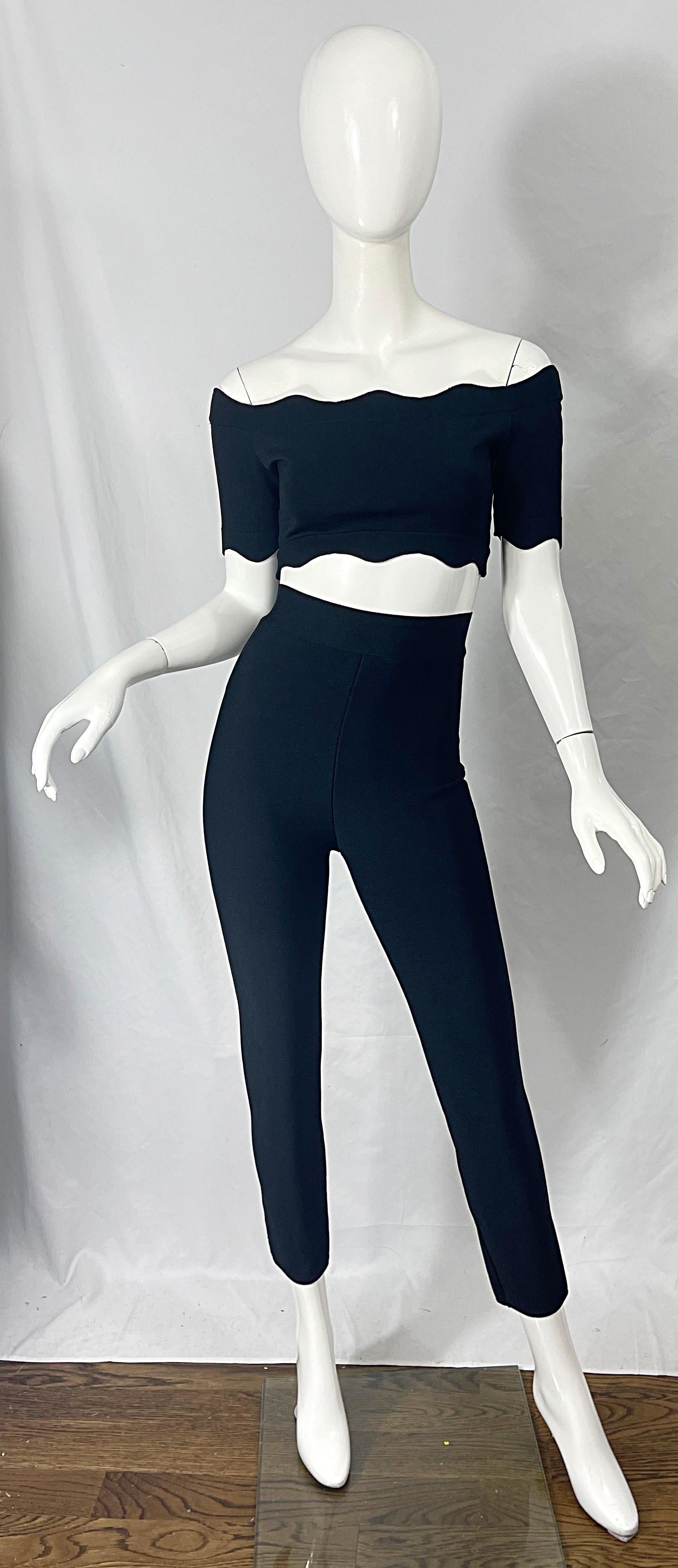 Rare sexy 90s HERVE LEGER black three piece ensemble ! Features a scallop trimmed crop top that simply slips over the head and stretches to fit. High waisted skin tight trousers have a zipper up the back. Long sleeve matching cardigan sweater