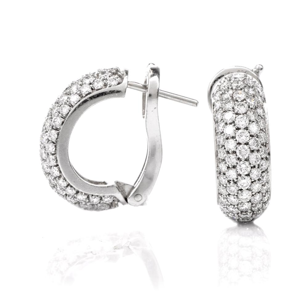 These classic high quality estate huggies diamond earrings are crafted in 18 Karat white gold. Featuring a cluster of diamonds round-cut prong set diamonds approx. 2.50 carat, G-H color, VS1-VS2 clarity. Secure with post and lever backs. Weighing