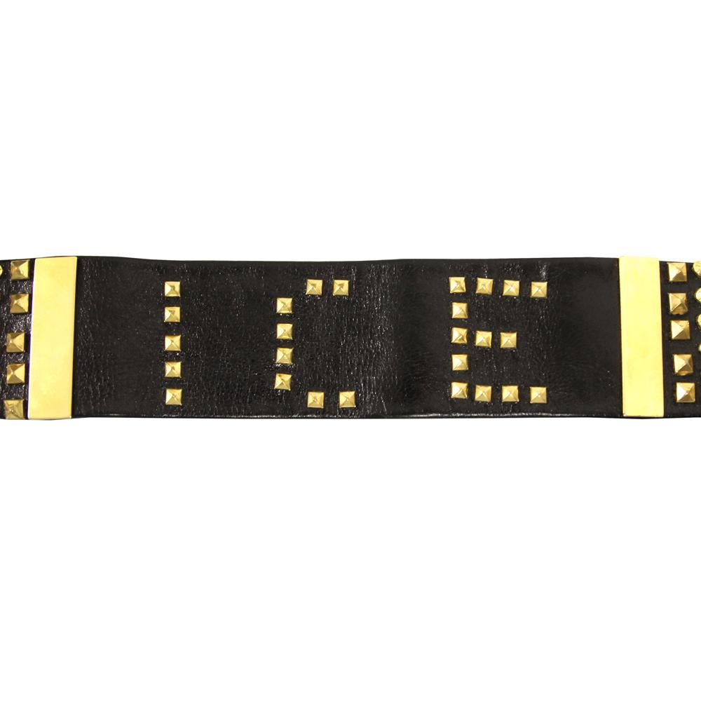 Iceberg black leather belt with decorative studs and golden metal buckle. 

Item shows light signs on the leather, as shown in the pictures. 

Years: 90s 

Made in Italy 

Measurements 
Length: 80 cm 
Height: 5 cm