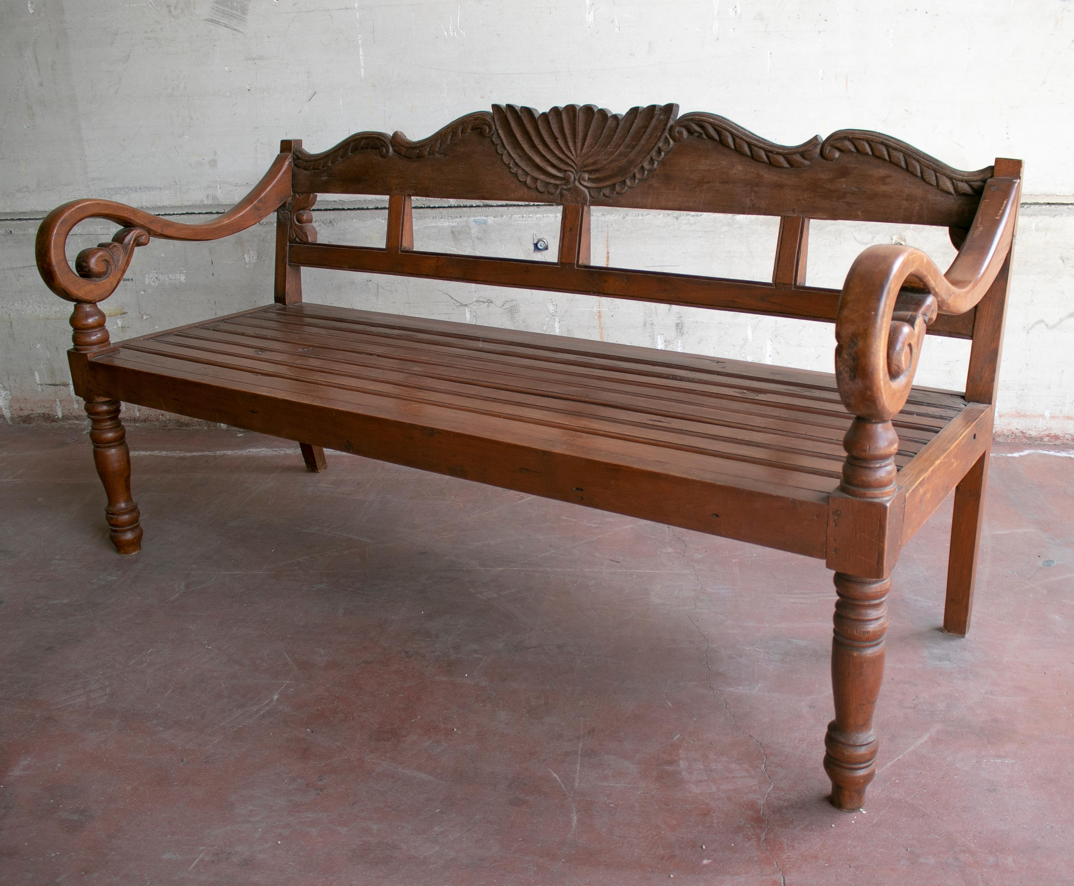 1990s Indonesian hand carved garden wooden seating bench.
