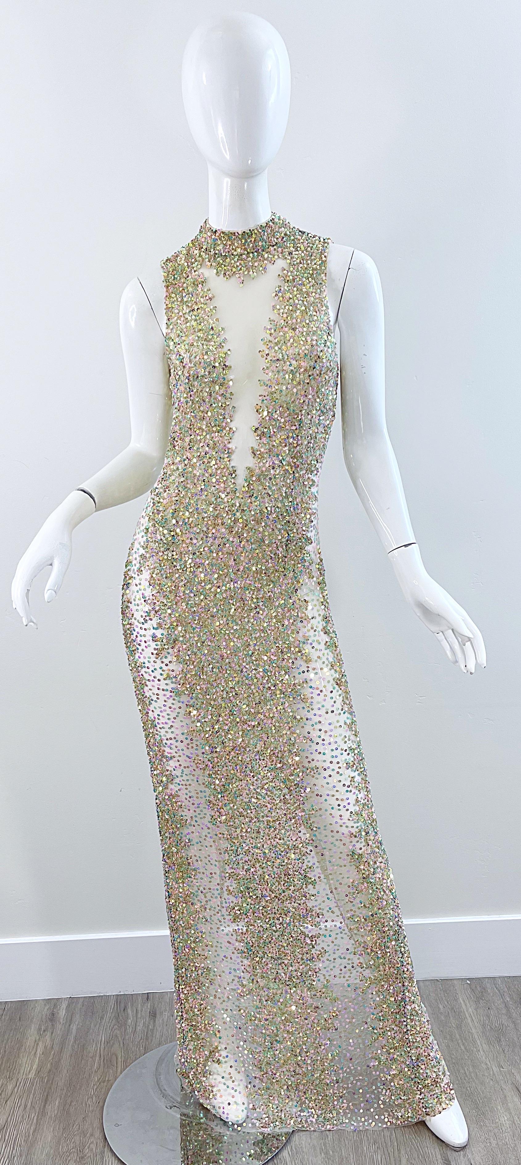 Beautiful 1990s iridescent sequined sheer mesh gown! Features thousands of hand-sewn sequins that are strategically placed for coverage. Hidden zipper up the back with hook-and-eye closure.
In great condition 
Made in USA
Approximately Size