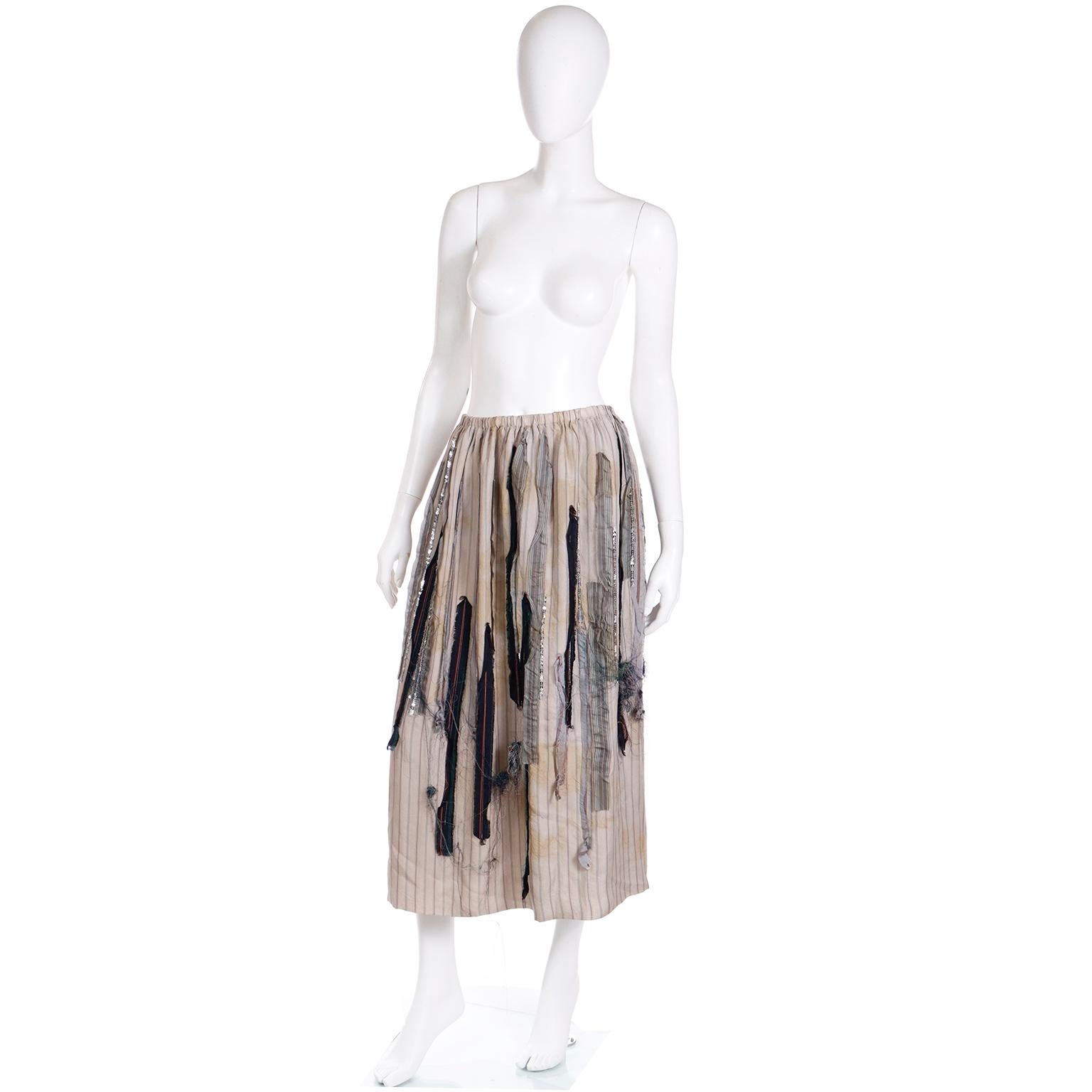 This is a really unique avant garde vintage skirt from I.S. designed by Sunao Kuwahara in the 1990's. Sunao Kuwahara started working for Issey Miyake in 1989 and then designed for this label in 1994. This deconstructed dove grey skirt has brick red,