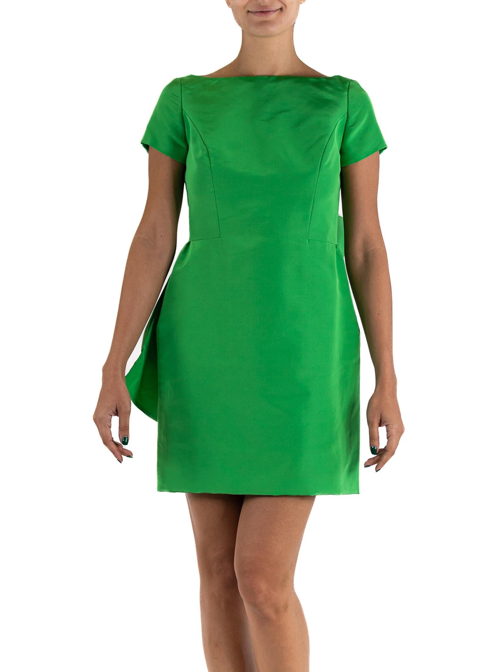 Fully lined with silk gazzar for structure. The finishing and construction on this dress is next level quality.  1990S ISAAC MIZRAHI Lime Green Silk Faille Cocktail Dress With Giant Bow Accent In Back 