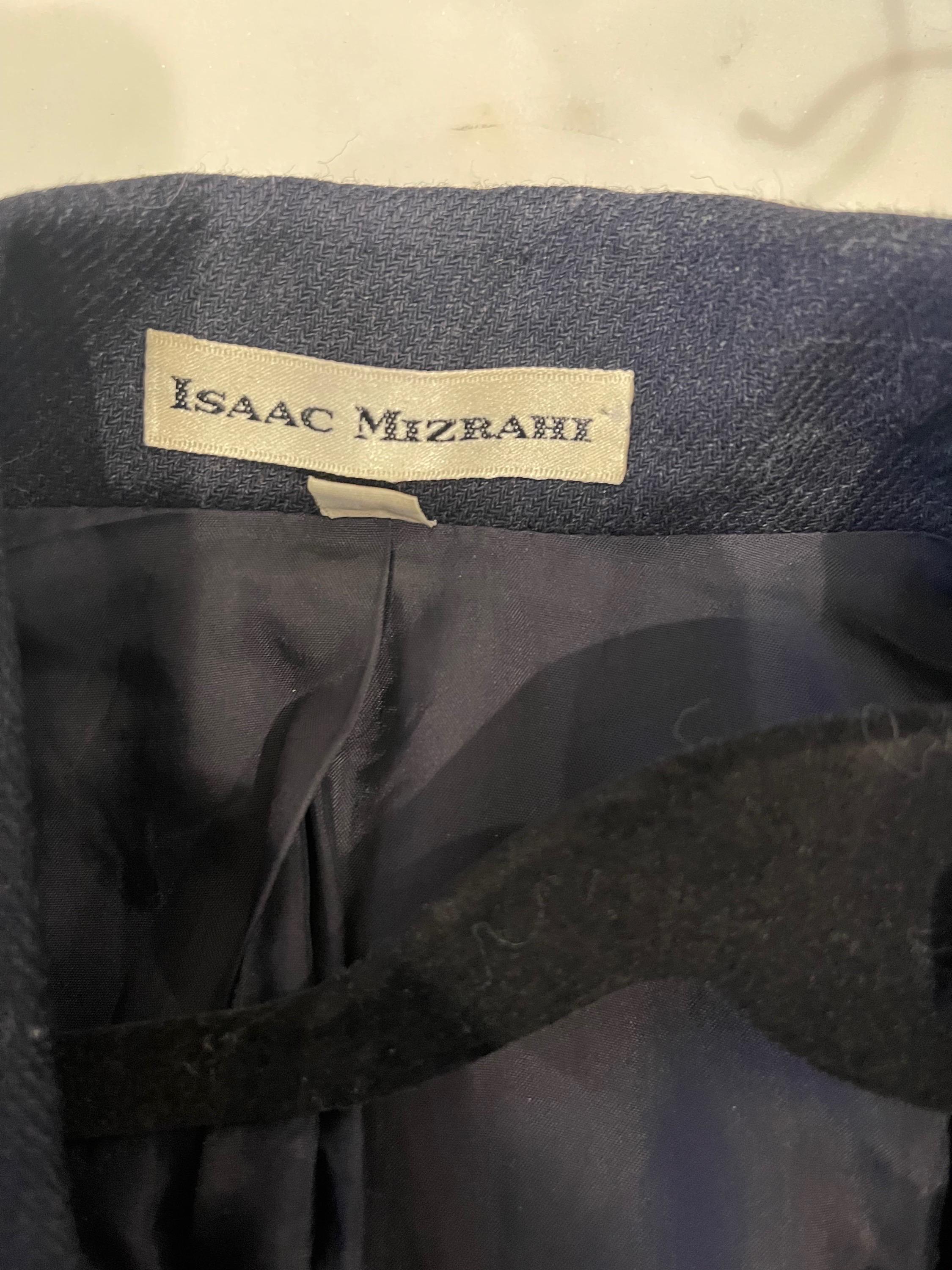 Chic vintage 90 Isaac Mizrahi navy blue denim like wrap blazer jacket ! Features bow details with wrap closure. Pocket at each side of the waist. Soft cotton and rayon fabric that is perfect for anytime of year.
In great unworn condition 
Made in