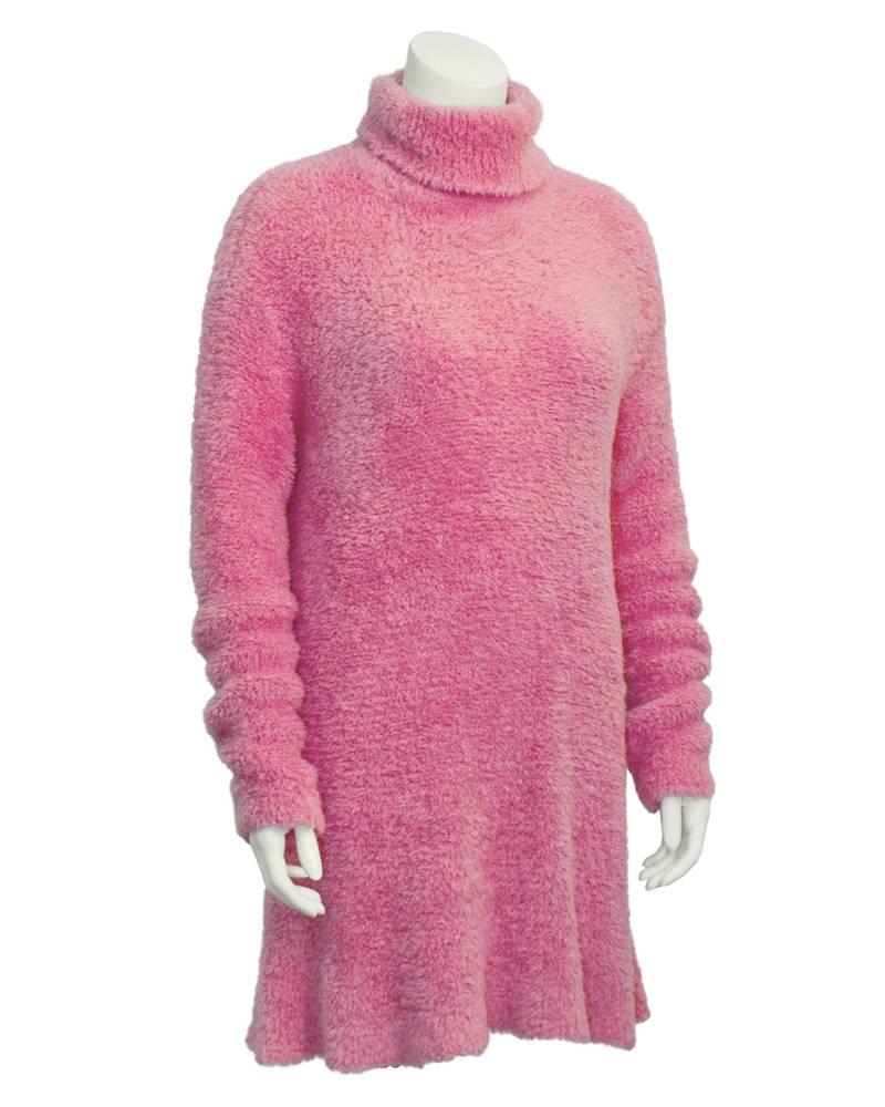 Super cute bubble gum pink, Isaac Mizrahi long sleeve turtleneck tunic style top from the 1990's. Made from a chenille style polyester knit. Extra long sleeves can be cuffed or scrunched. Has a loose, dress like quality. Can be worn over jeans with
