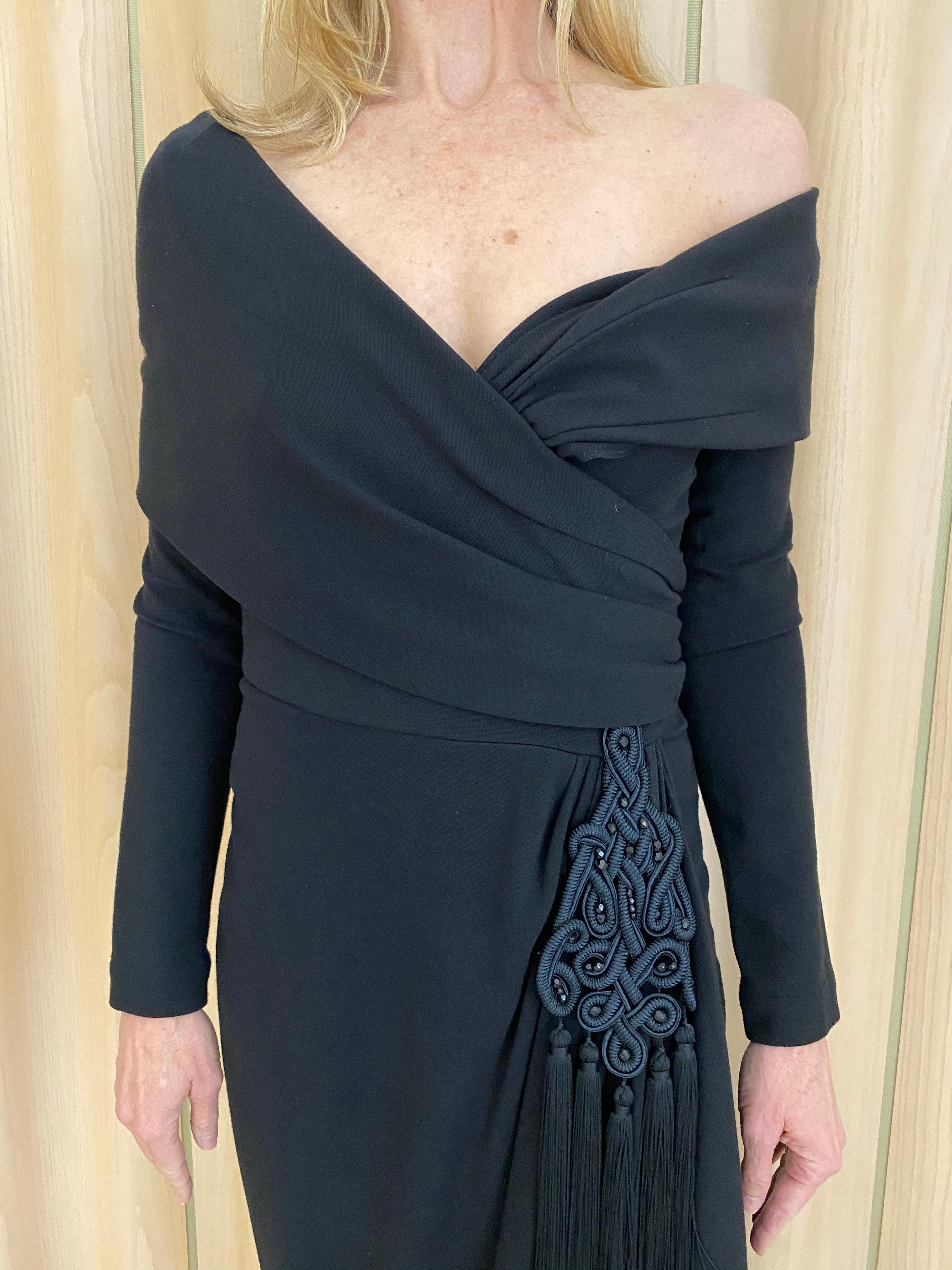 Elegant 1990s Isabelle Allard Black Knit Jersey Off Shoulder Long Sleeve Gown with tassel.
Fabric has some stretch. Perfect gown for wedding or black tie event.
Bust 36” / Waist 28” / 