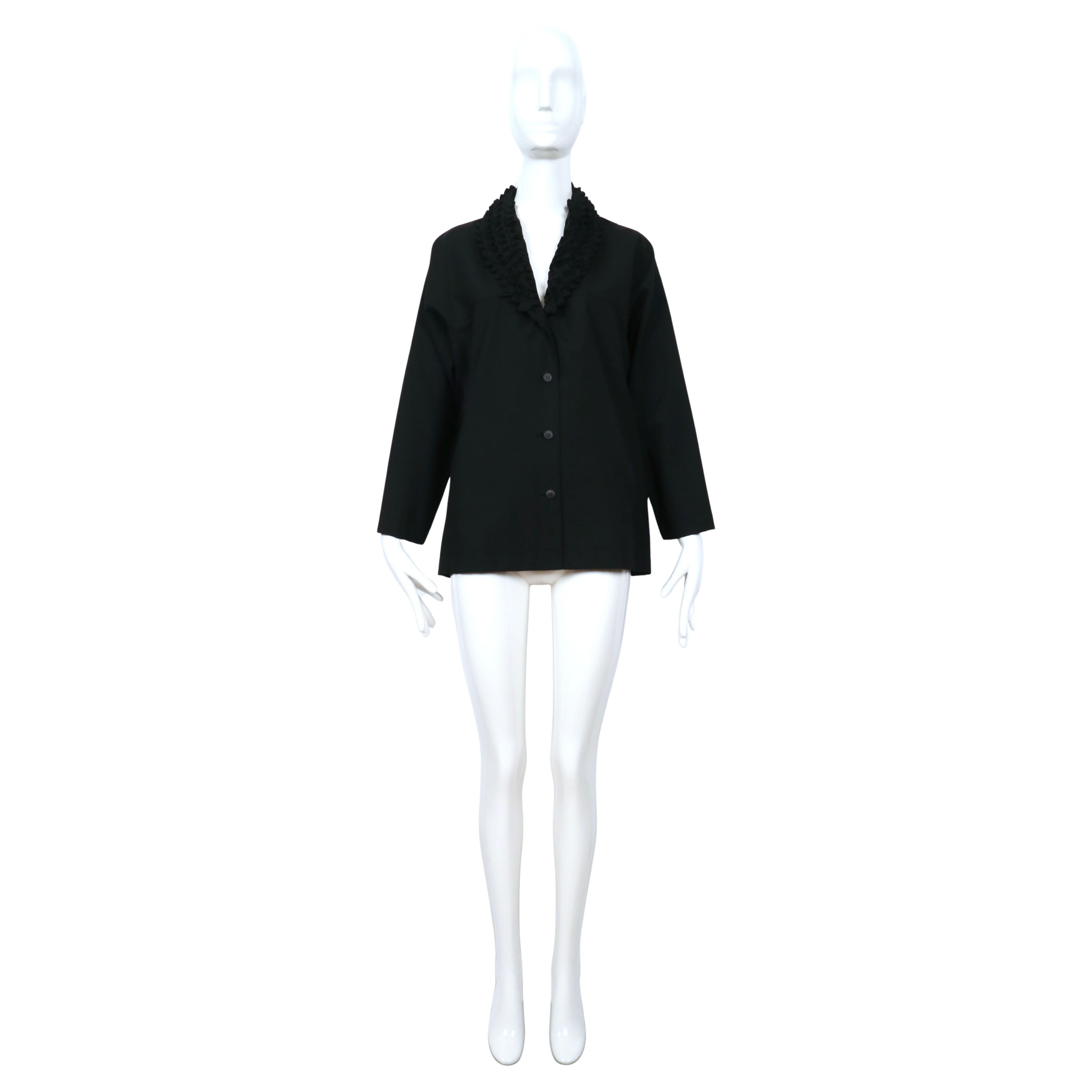 Jet-black, lightweight wool and cashmere jacket with unique origami collar designed by Issey Miyake dating to the late 1990's. The complex construction of the collar is nothing short of spectacular. It is sewn in a way that creates a three