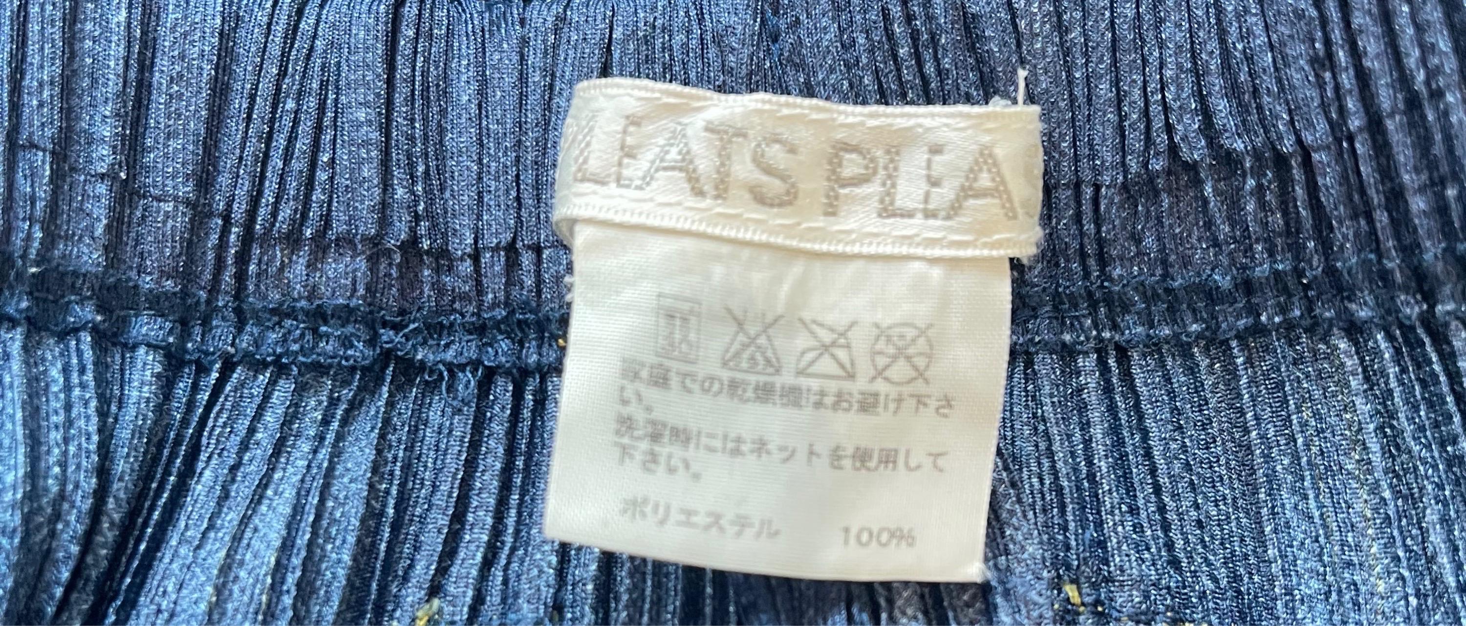 Amazing vintage 1990s Issey Miyake Pleats Please trompe l’oeil pleated pants ! At first glance, these look like a pair of blue jeans. Stitching around front and rear pockets, belt loops and waistband.
The pictured vintage Issey Miyake blouse is also