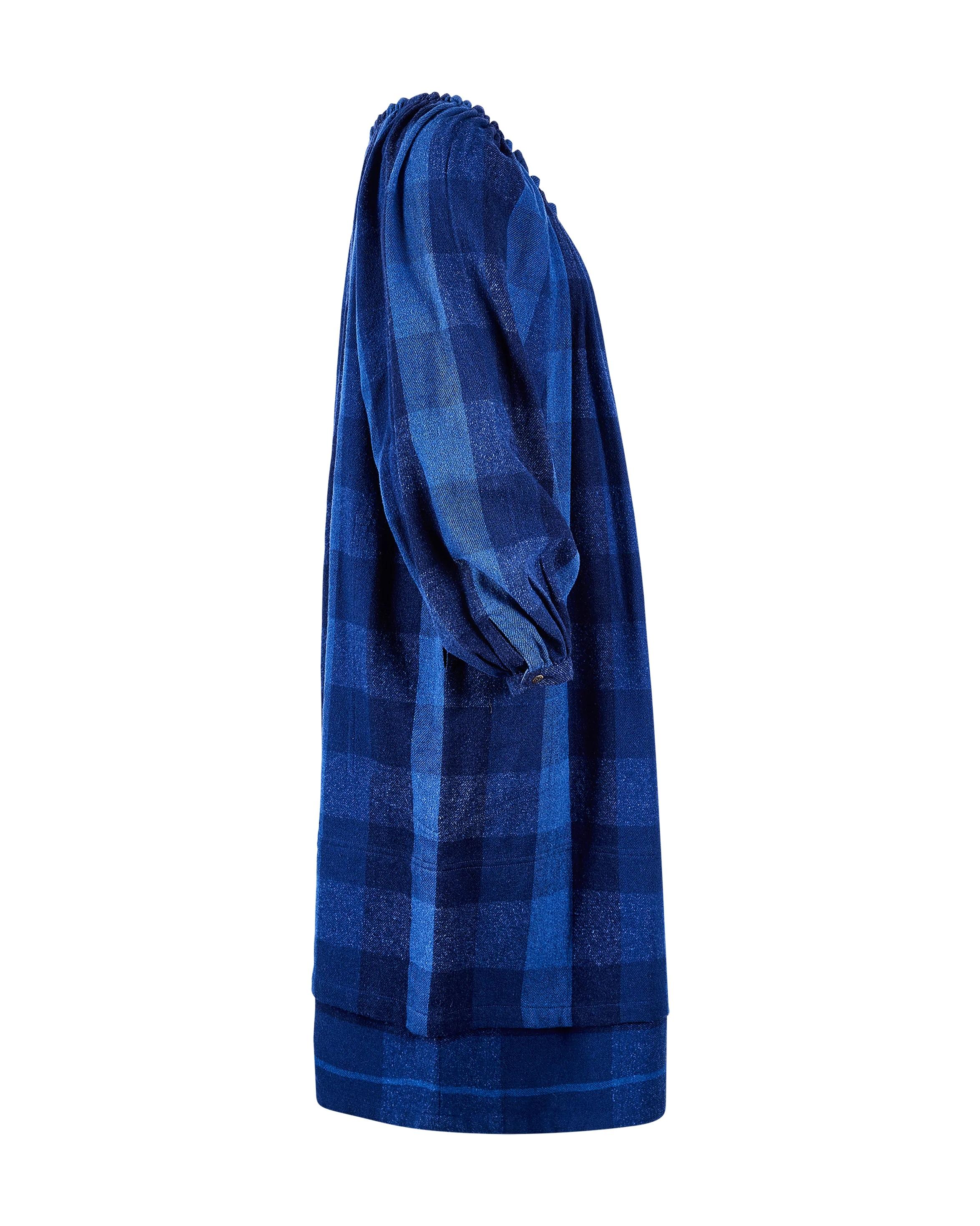 1990's Issey Miyake 'Sport' tartan print blue dress. Long sleeve midi dress with deep blue and black tartan pattern throughout. Features functional front pockets and gathered neckline. Single button closure at wrists and side slit pockets, with