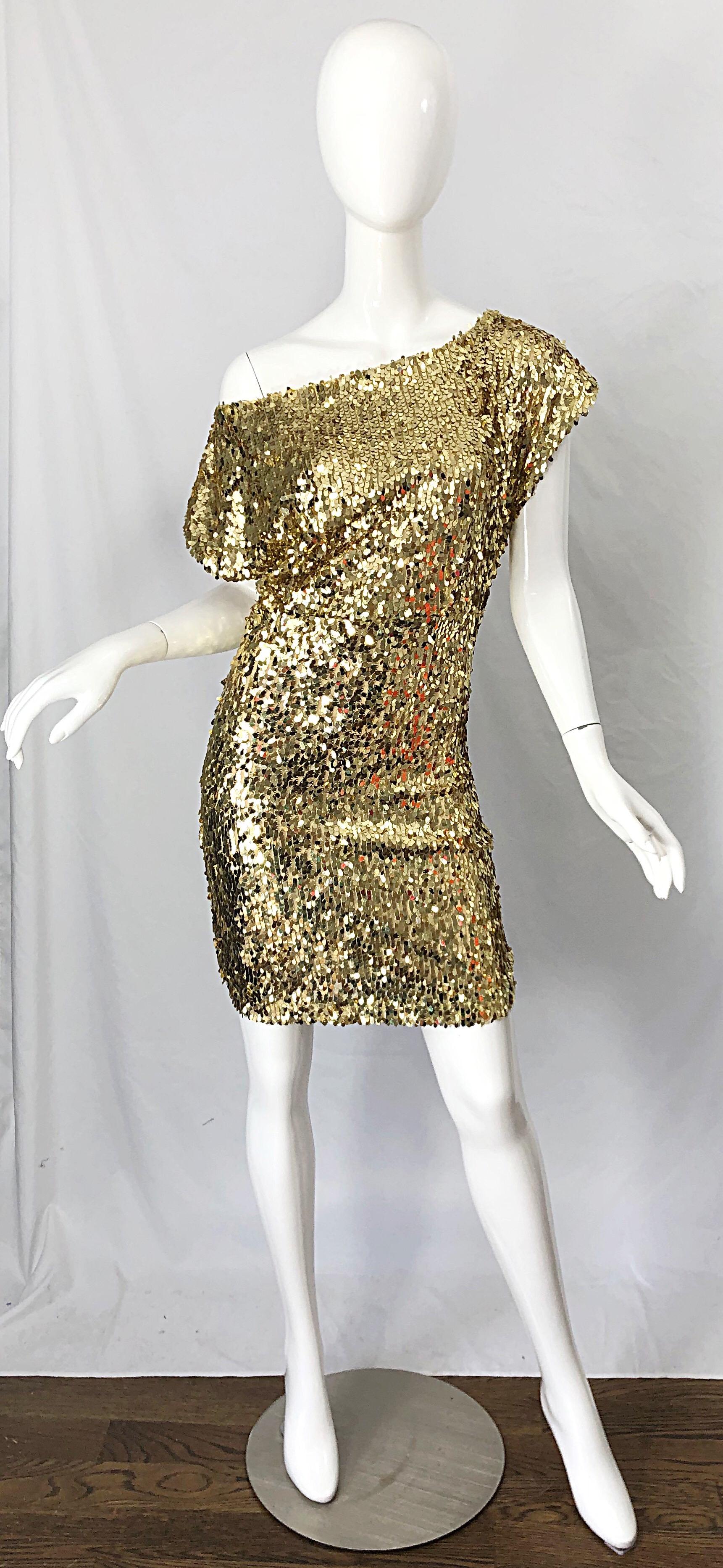 Sexy late 1990s Italian gold sequined off-the-shoulder dress ! Features thousands of hand-sewn sequins throughout the entire dress. Can be worn many ways ( as pictured ). Hidden zipper up the side with hook-and-eye closure. Perfect with sandals or