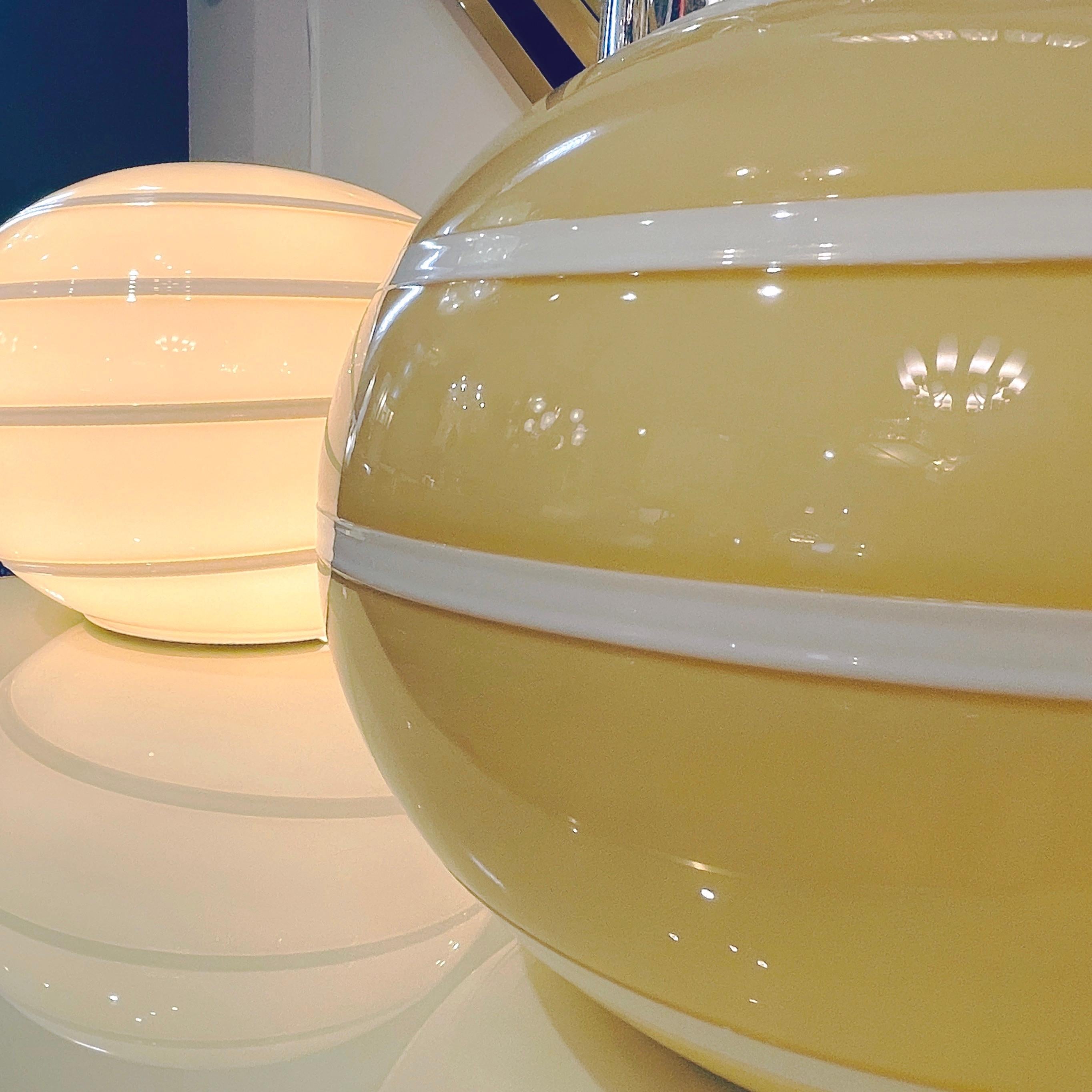 Late 20th Century 1990s Italian Mid-Century Modern Pair of White & Golden Cream Globe Glass Lamps