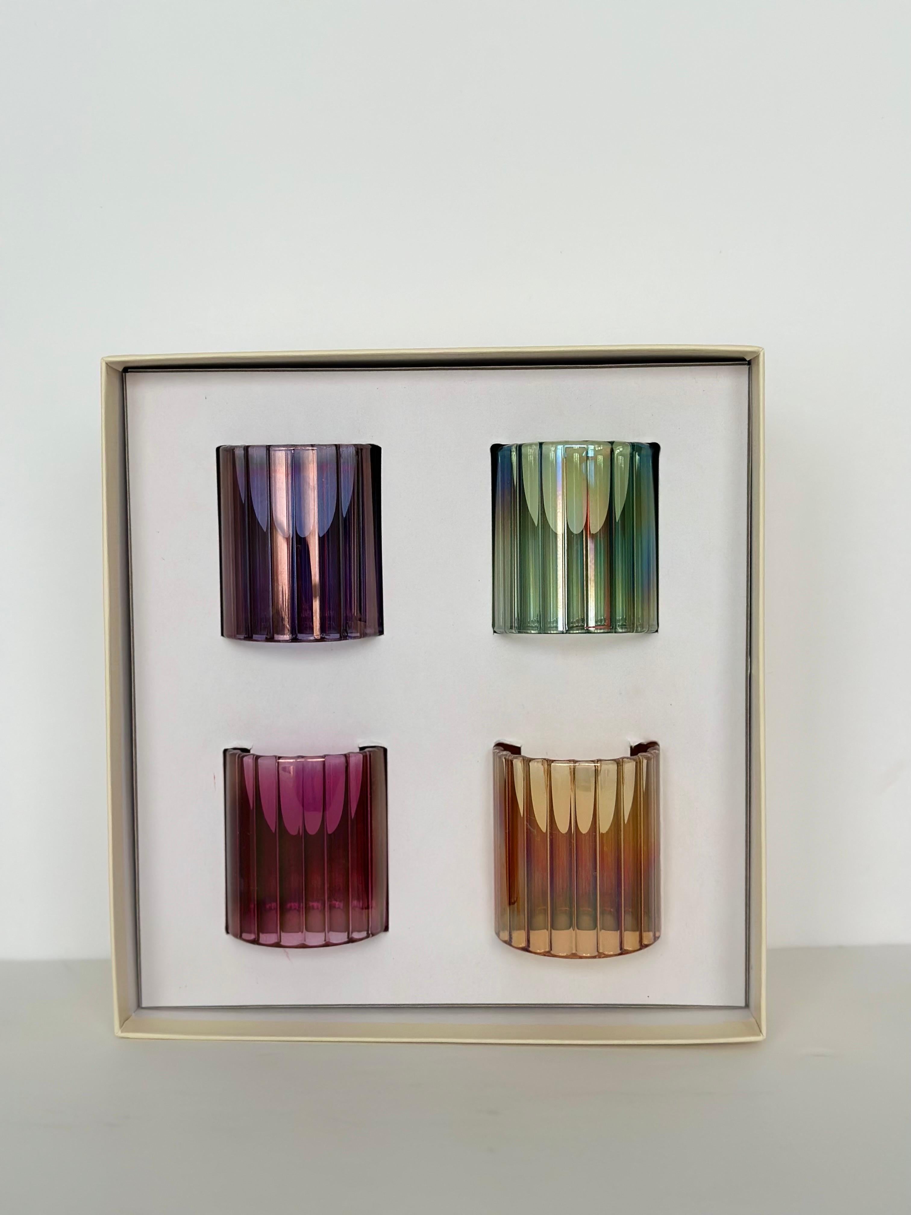 We are very pleased to introduce a vintage set of napkin holders, made in Italy and sold by Neiman Marcus, circa the 1990s.  This set of four exquisite handmade blown napkin holders are made of high-quality borosilicate glass.  Each napkin holder