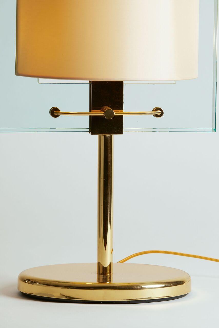 1990's Italy Nathalie Grenon for Fontana Arte brass and glass table lamp.