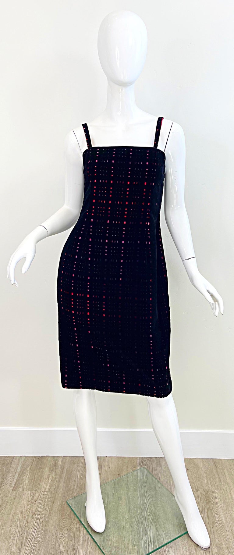 Amazing 1990s JAMES PURCELL black silk cut-out velvet with red tartan plaid silk taffeta underlay. Features a tailored bodice with hidden zipper up the back and hook-and-eye closure. Couture quality one would expect from this designer. 
Fun fact