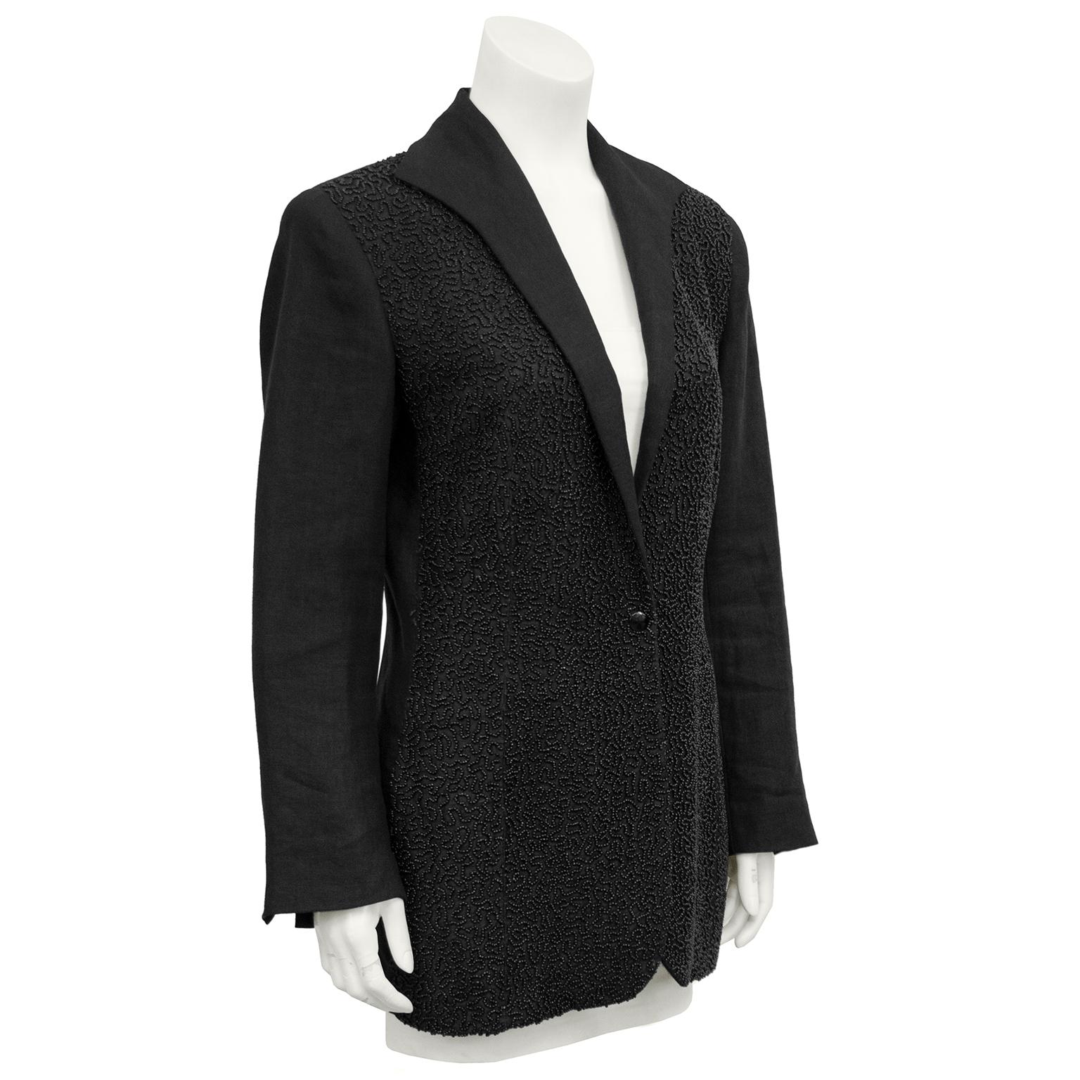 1990s Jean Paul Gaultier black linen blazer. Front entirely embellished in tiny metallic grey beadings in an allover design. Single front black button. Elongated, curved lapel. Five matching black buttons at cuffs. Blazer is equestrian style,