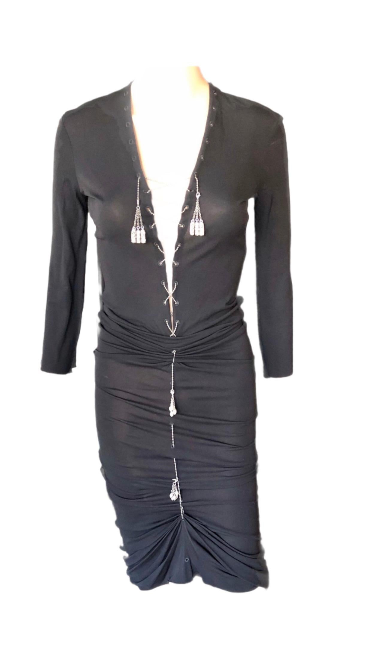 1990's Jean Paul Gaultier Semi-Sheer Lace Up Metal Chain Embellished Black Knit Dress IT 42

Jean Paul Gaultier maxi dress with V-neck featuring silver-tone metal chain embellishment with tassels at front and long sleeves.