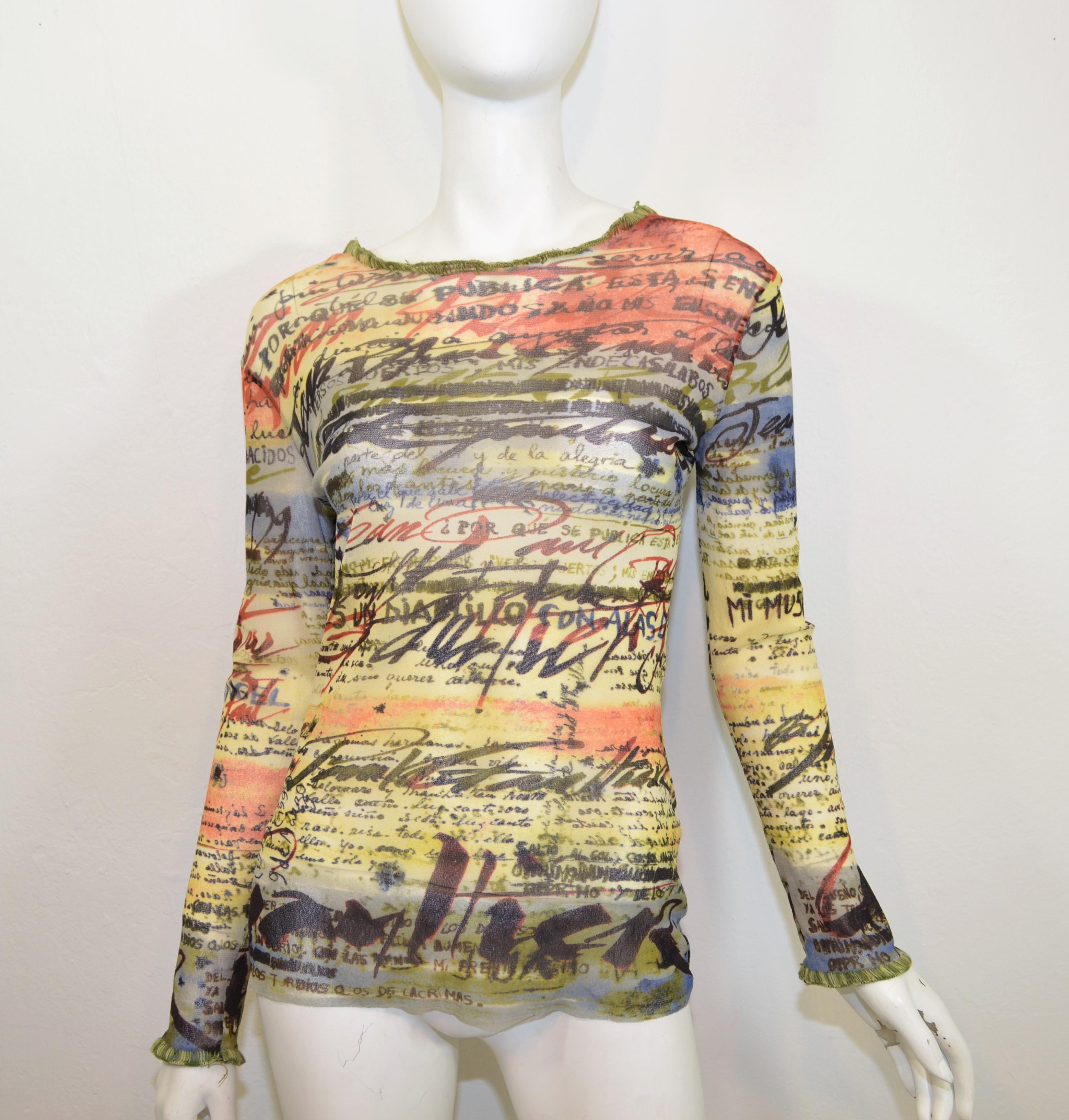 Jean Paul Gaultier mesh top features a multi-color graffiti-inspired print throughout with a loose knit trim along the opening and at the cuffs. Top is labeled a size M, made in Italy.

Measurements:
bust 37''
sleeves 23''
length 25''