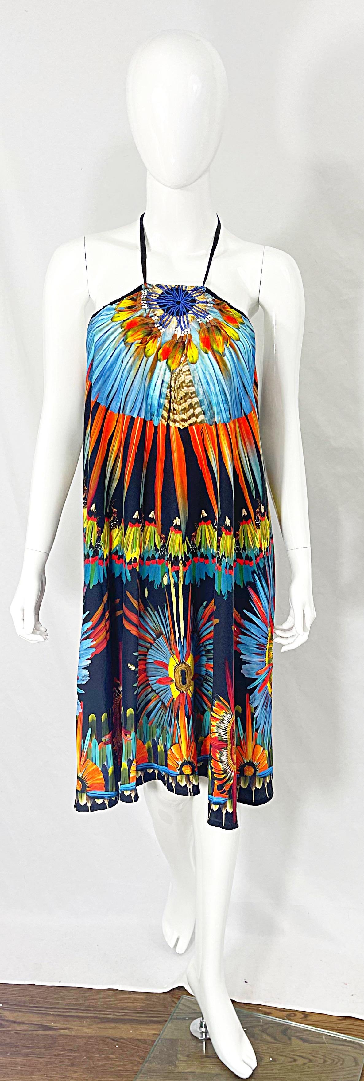 Chic 90s vintage JEAN PAUL GAULTIER brightly colored novelty feather print rayon halter dress ! The neckline features what looks to be a feathered necklace. Bright colors of orange, yellow, blue, and red throughout. Ties at top back neck with brass