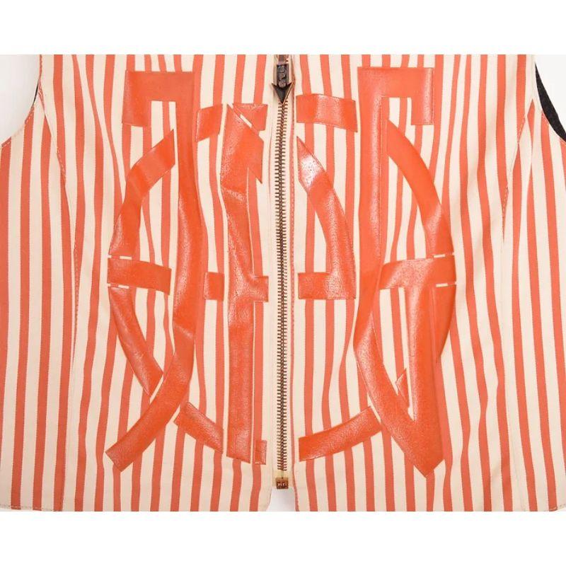 Incredible Vintage 1990's Jean Paul Gaultier JPG label pinstriped Vest jacket in terracota orange and off white. Featuring the iconic and bold JPG printed Jelly logo on the front. 

This Piece can be worn both alone and layered.

MADE IN