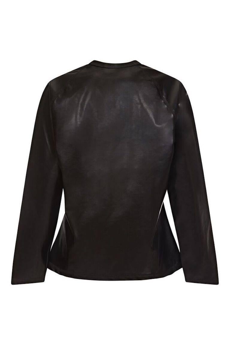 This unusual Jean Paul Gaultier black PVC sweatshirt, circa 1994, with soft cotton lining has some distinctive features synonymous with this celebrated designer's trademark urban sensibilities and is from the 