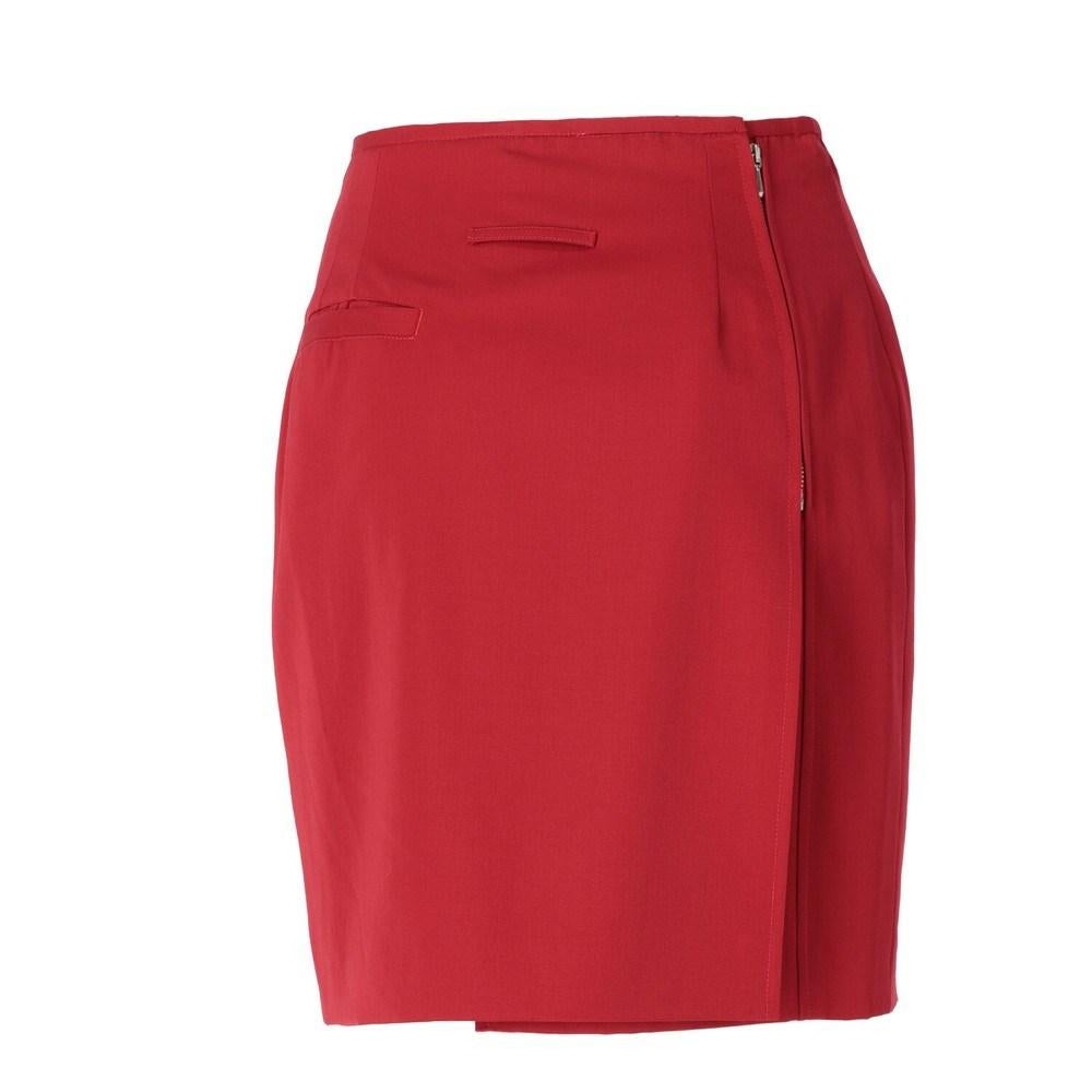 Jean Paul Gaultier red cotton blend fabric skirt. Wallet model, side zip closure and welt pocket with button. Slim fit.

Size: 44 IT

Flat measurements
Lenght: 47 cm
Waist: 33 cm

Product code: X0322

Composition: 80% Cotton - 20% Polyester

Made
