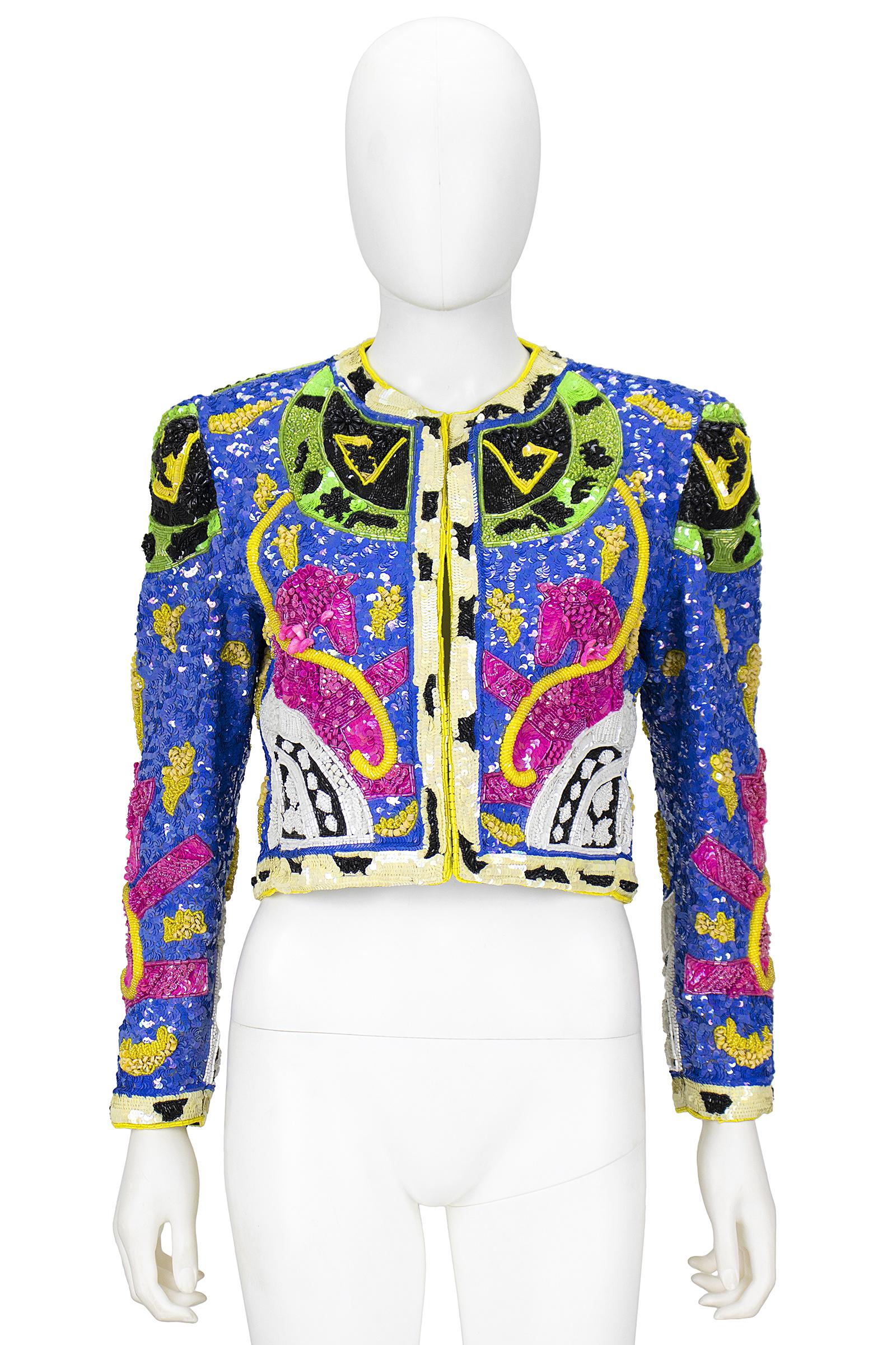 Jeanette Platinum jacket 
Black silk with multi-color sequins and beading in a unicorn design 
Hook and eye closures 
Size S
Made in the USA 
Has tag with signature and the date December 17, 1992 

*Please feel free to contact us with the 
