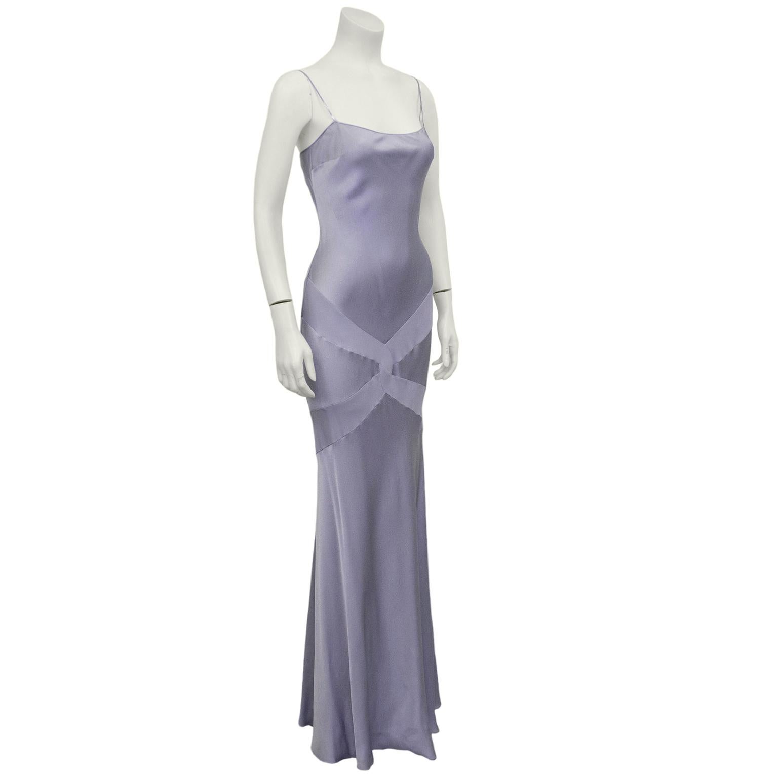 Sexy 1990s John Galliano metallic lavender silk gown. Blueish grey trim and very thing straps. Long row of small covered buttons at left side when wearing. Woven cross detail at hips with flowing floor length skirt. Very good vintage condition. Fits