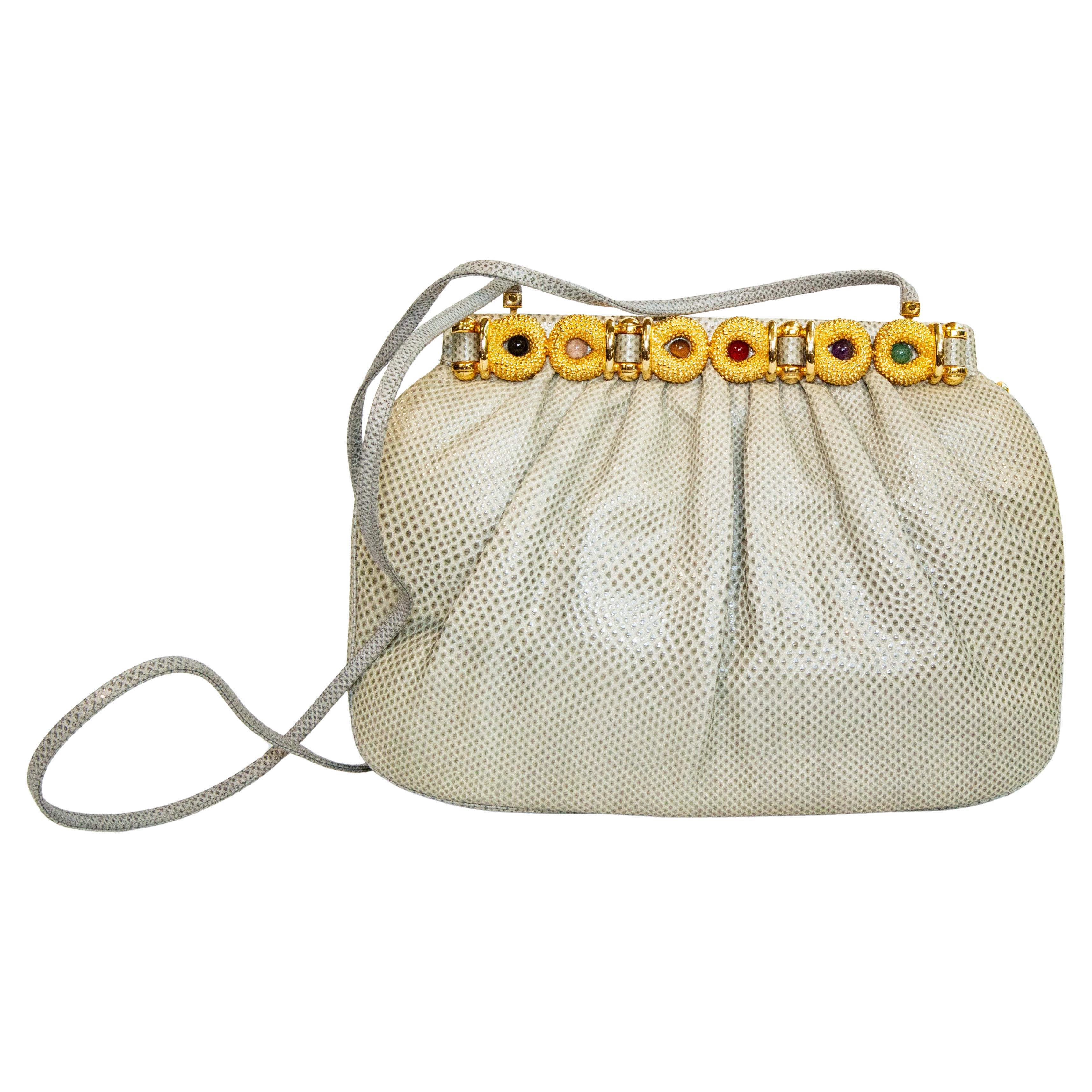 Pochette Judith Leiber in lucertola, anni '90, per una borsa a tracolla.