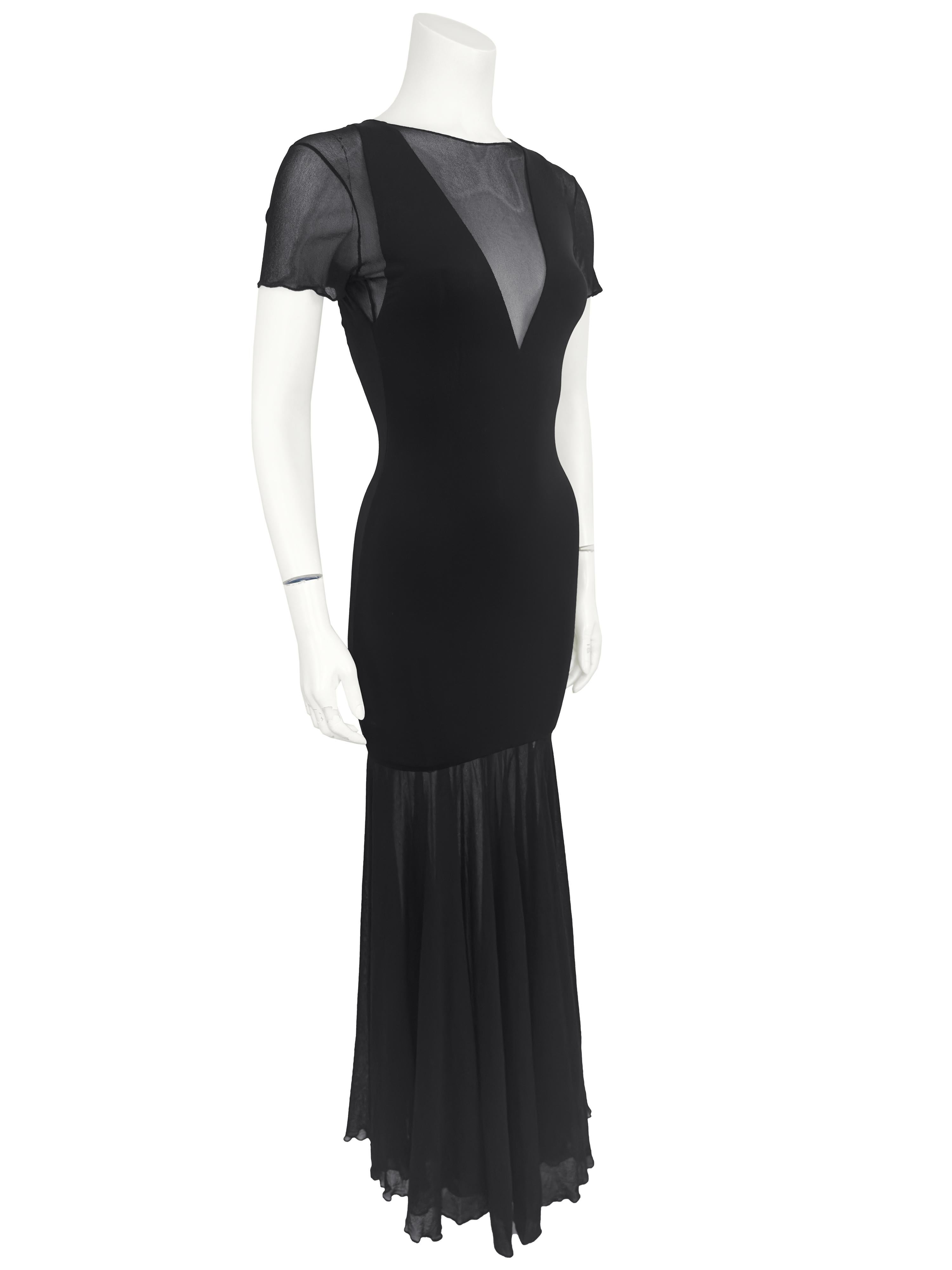 Slinky Karl Lagerfeld body con mermaid style gown from the 1980s. A mix of solid black lycra through the body and black mesh at the short sleeves, yoke, back and skirt. Very sexy, while still elegant. Excellent vintage condition. Can be worn on