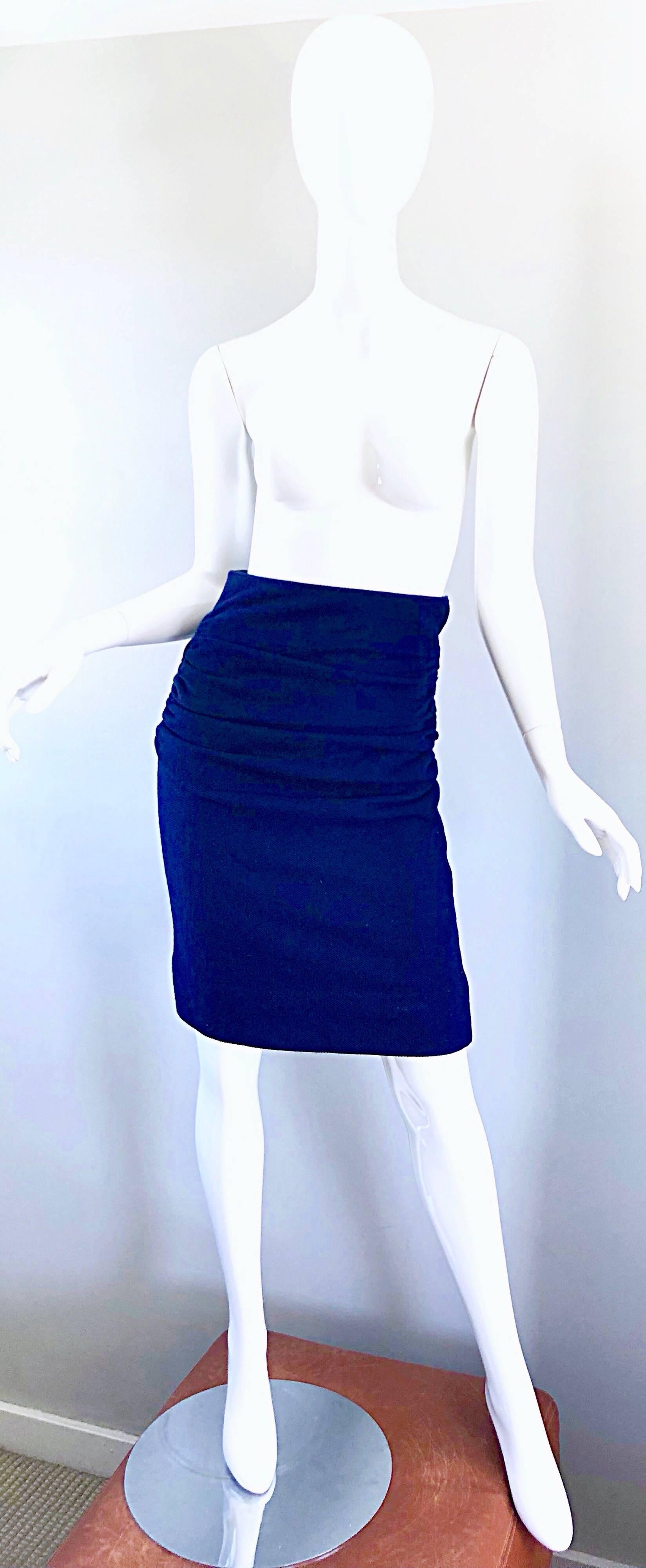 Super flattering early 1990s KARL LAGERFELD navy blue ruched virgin wool high waisted pencil skirt! Not just your basic pencil skirt...This gem features a dark midnight / navy blue soft textured virgin wool. Super flattering and forgiving ruching