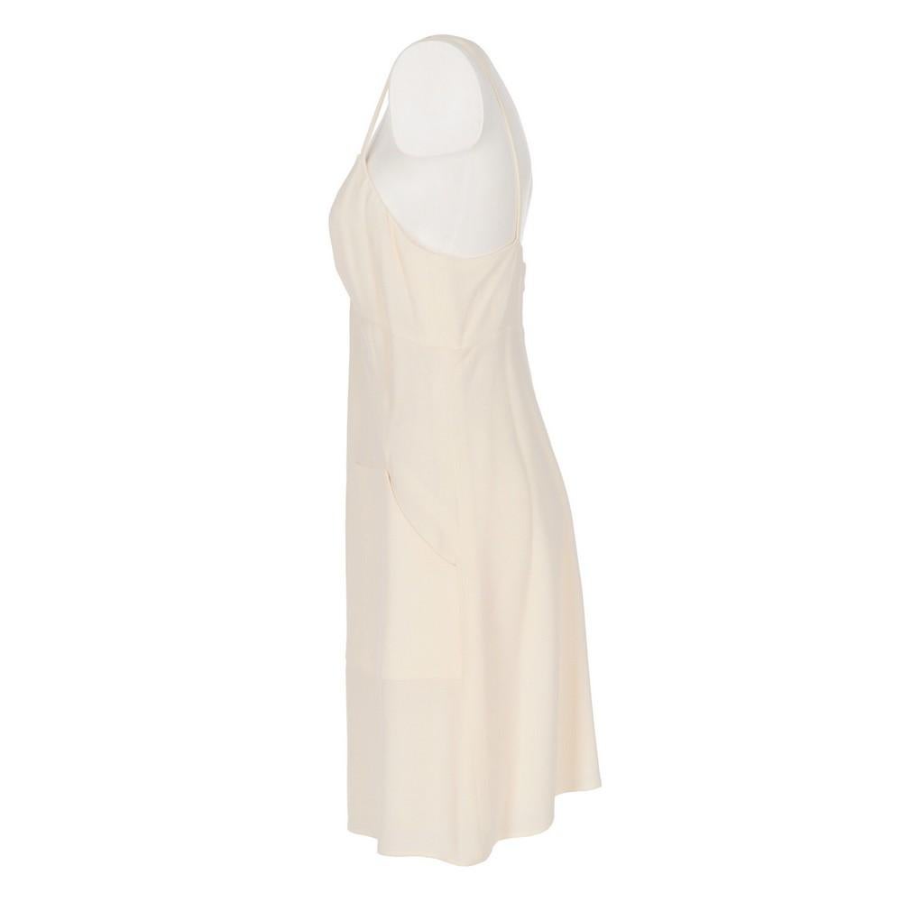 Karl Lagerfeld ivory-tone jumpsuit and vest suit. The jumpsuit features a V-neck, thin shoulder straps, two patch pockets and concealed zip back fastening. Long vest with lapel collar, single front button and two side slits.
Item shows light halos