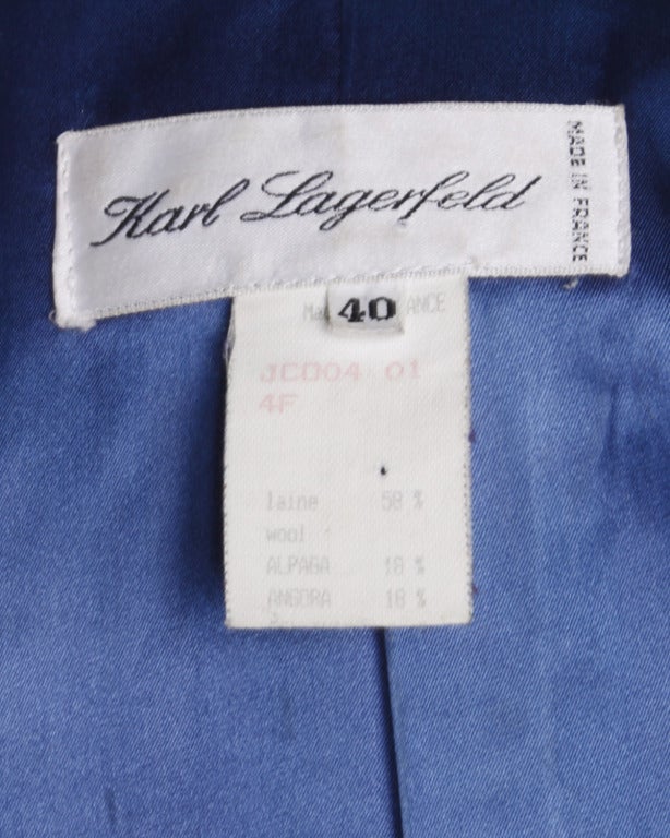 Amazing teal blue vintage coat by Karl Lagerfeld in a heavy wool, alpaca and angora blend. Oversized fit with notched lapels, thick sleeve cuffs and triangular patch pockets. Comes with a matching sash belt.

Details

Partially lined
Open